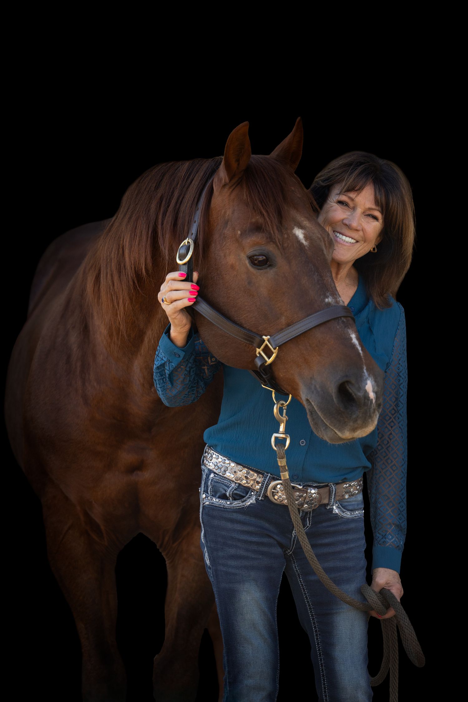 Portrait session showing interaction between a chestnut horse and person in blue denim.