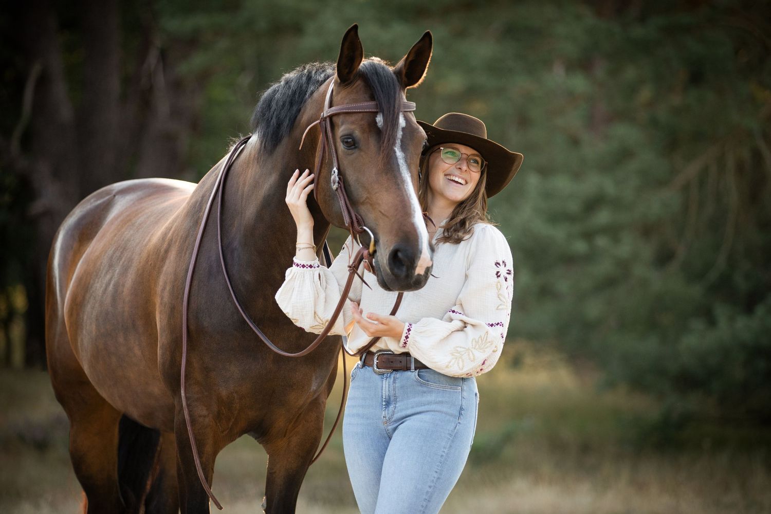 Horse standing calmly in outdoor setting with natural background.