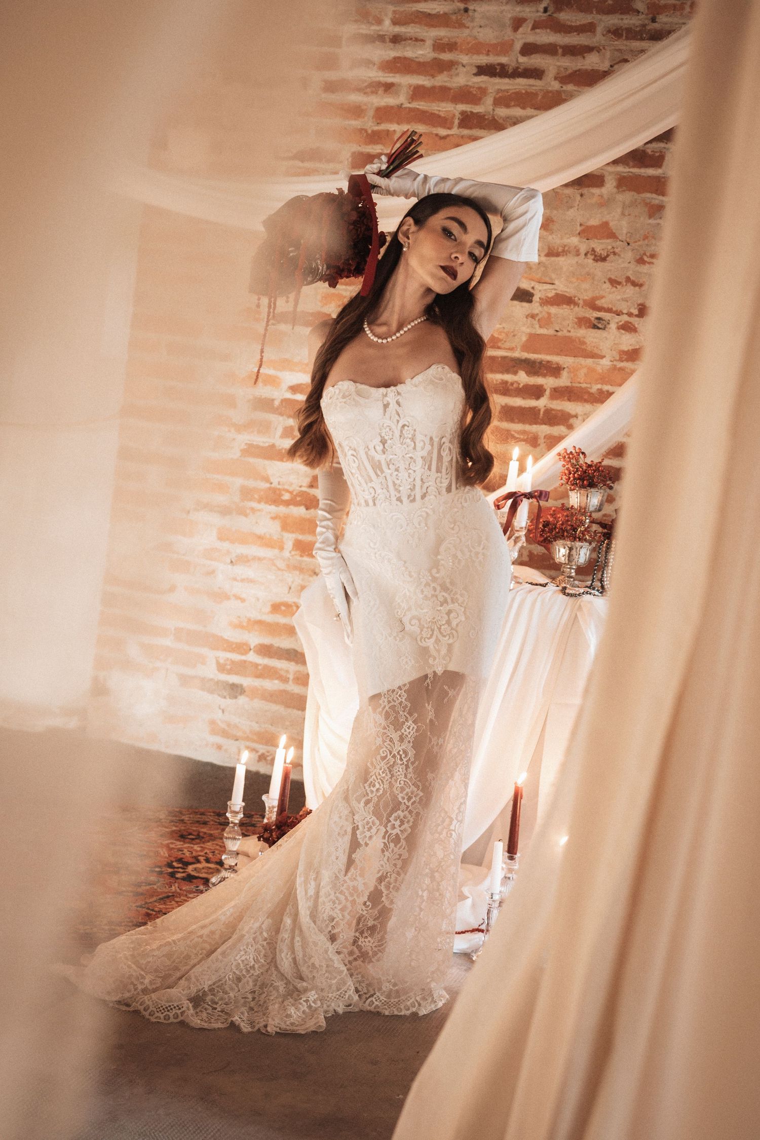 Ethereal bridal portrait sequence featuring lace wedding dress and dramatic poses in vintage setting.