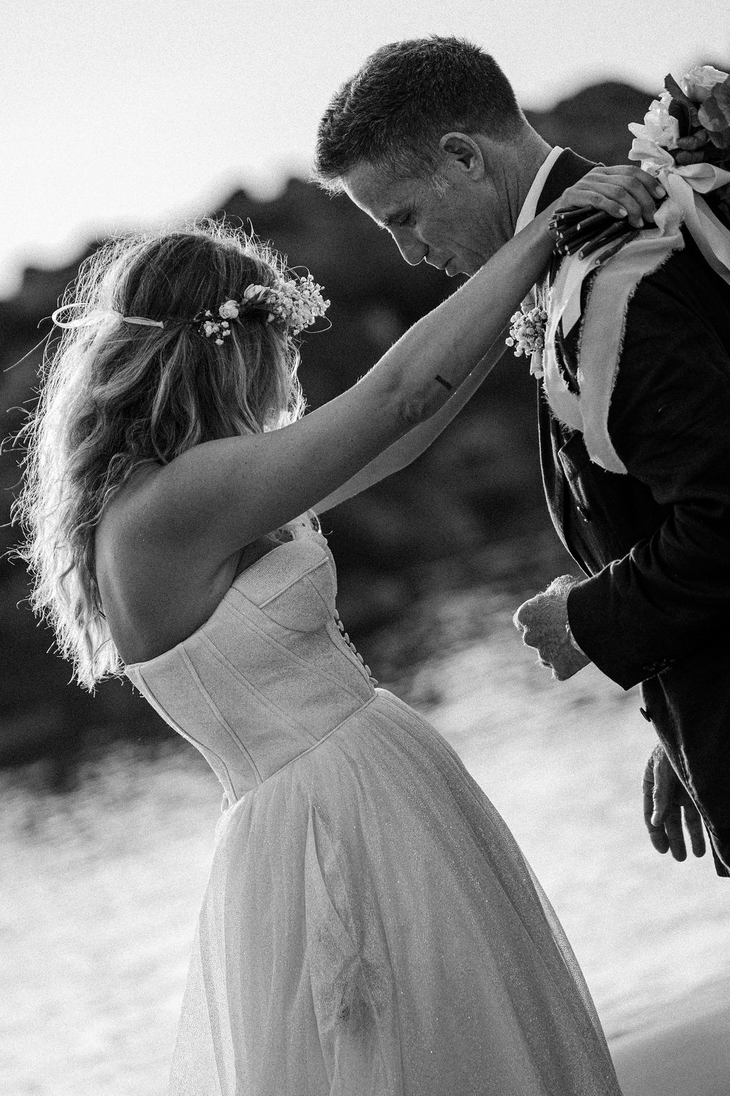 A romantic black and white wedding photo sequence showing a couple dancing together in flowing motion.