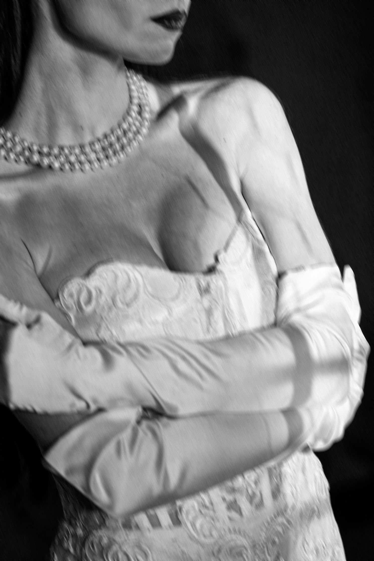 Vintage-inspired black and white portrait series showcasing elegant white dress and lace details.