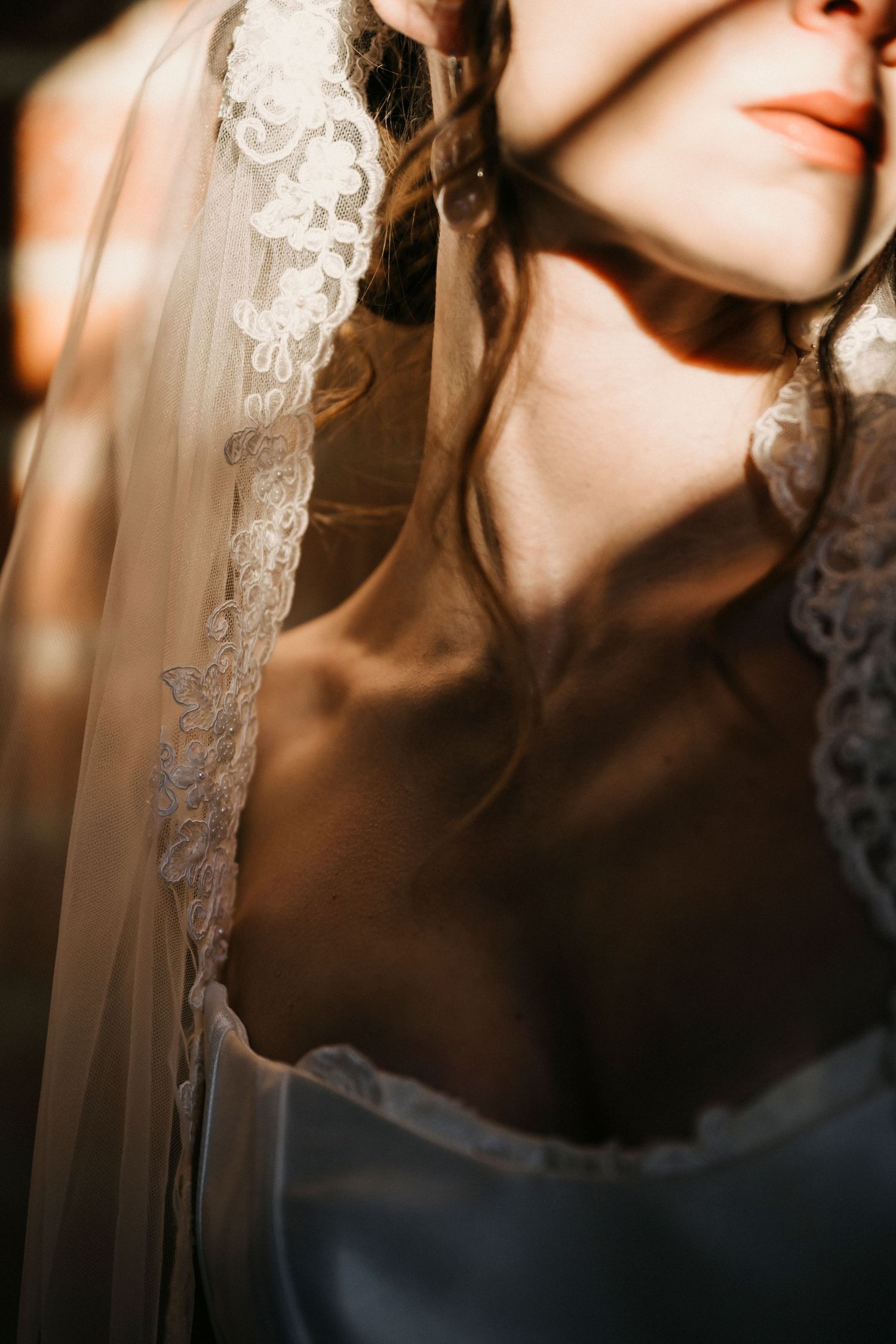 Delicate lace details and soft lighting create a romantic bridal aesthetic.