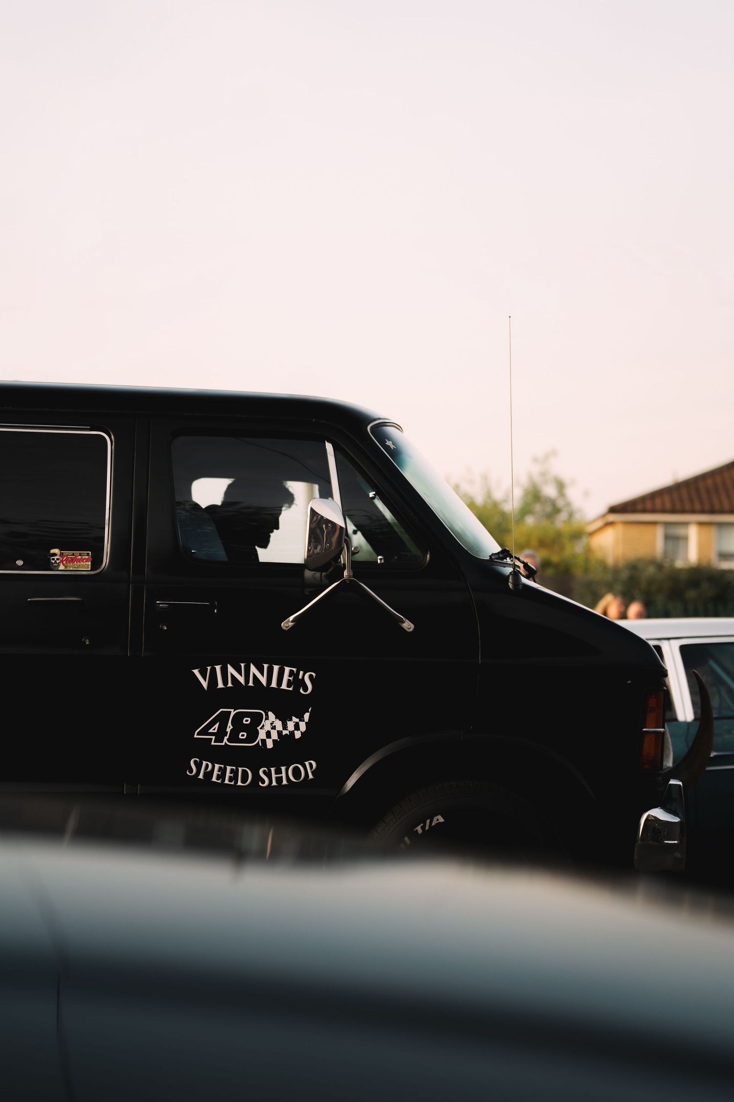 Black van with Vinnie's Speed Shop logo and number 46, parked outdoors at dusk.