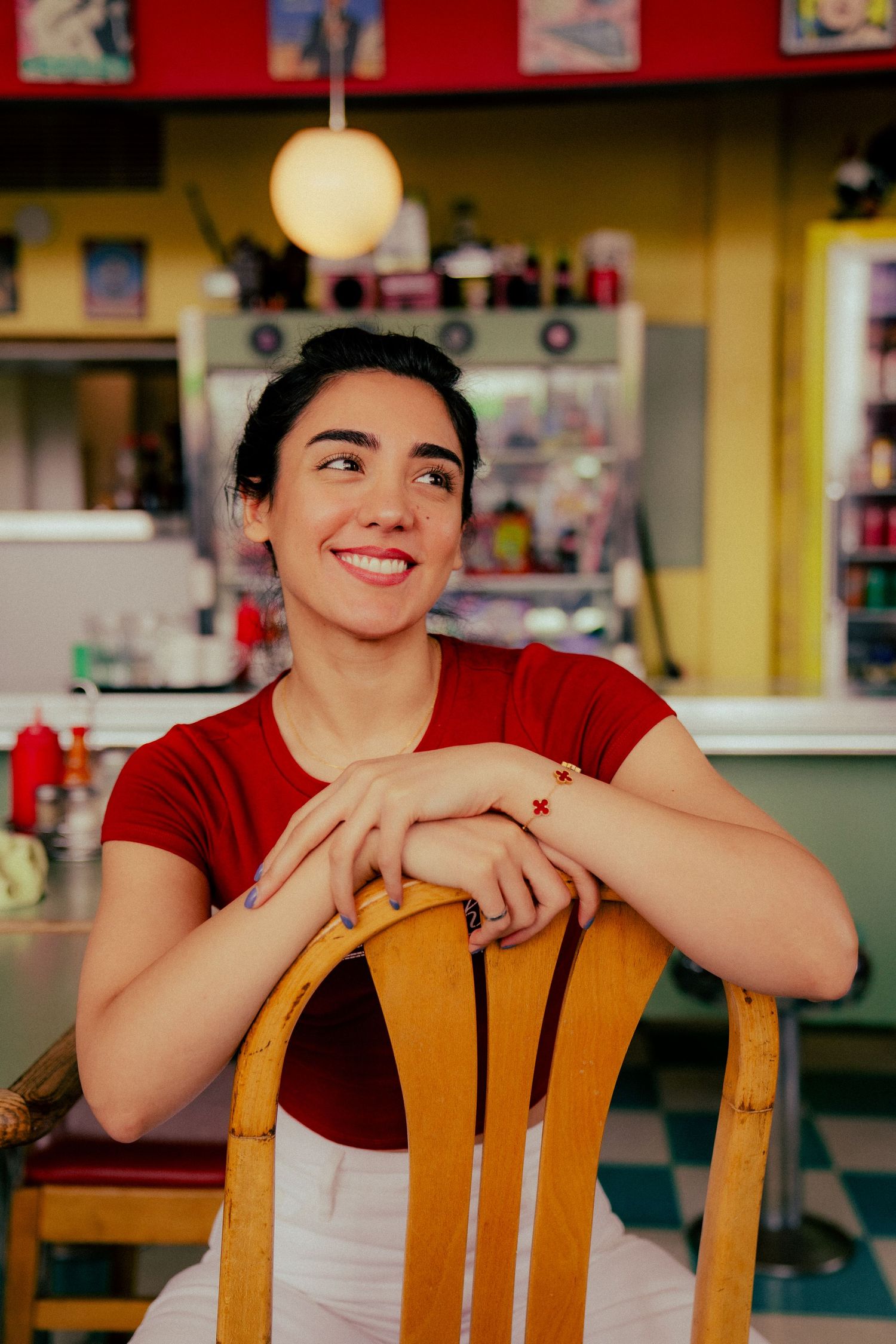 A retro-style diner interior with vintage decor and warm lighting creates a nostalgic atmosphere.