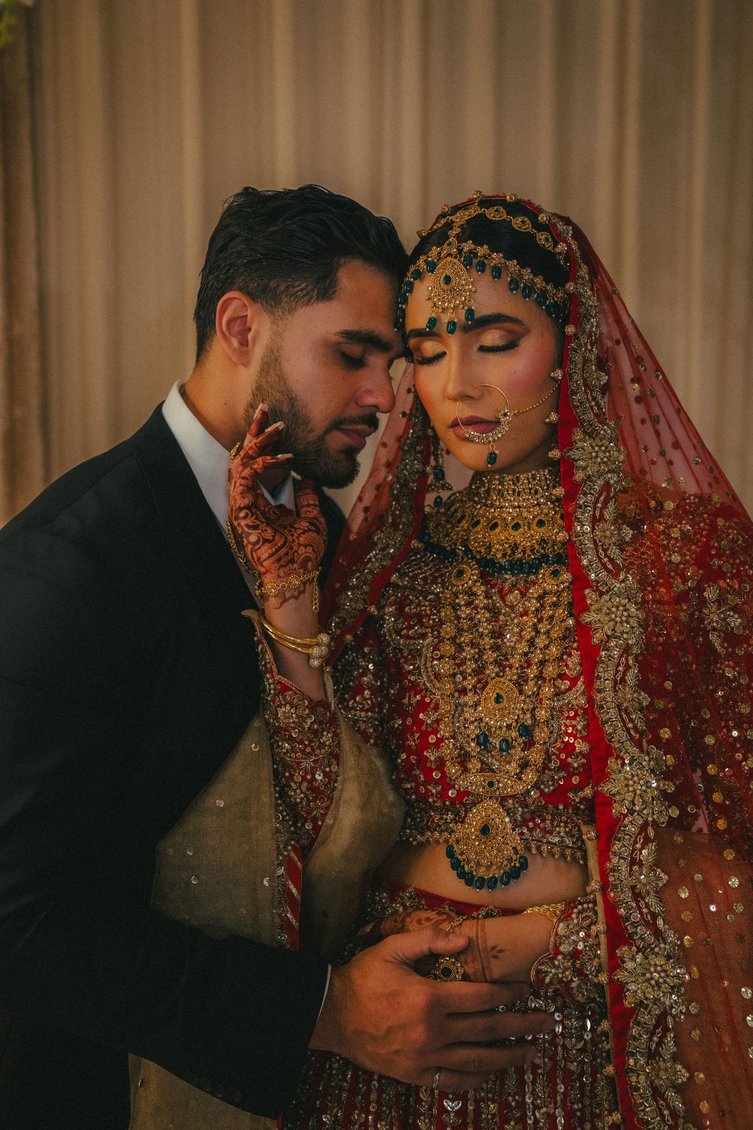 A series of intimate moments captured of a couple in traditional South Asian wedding attire.