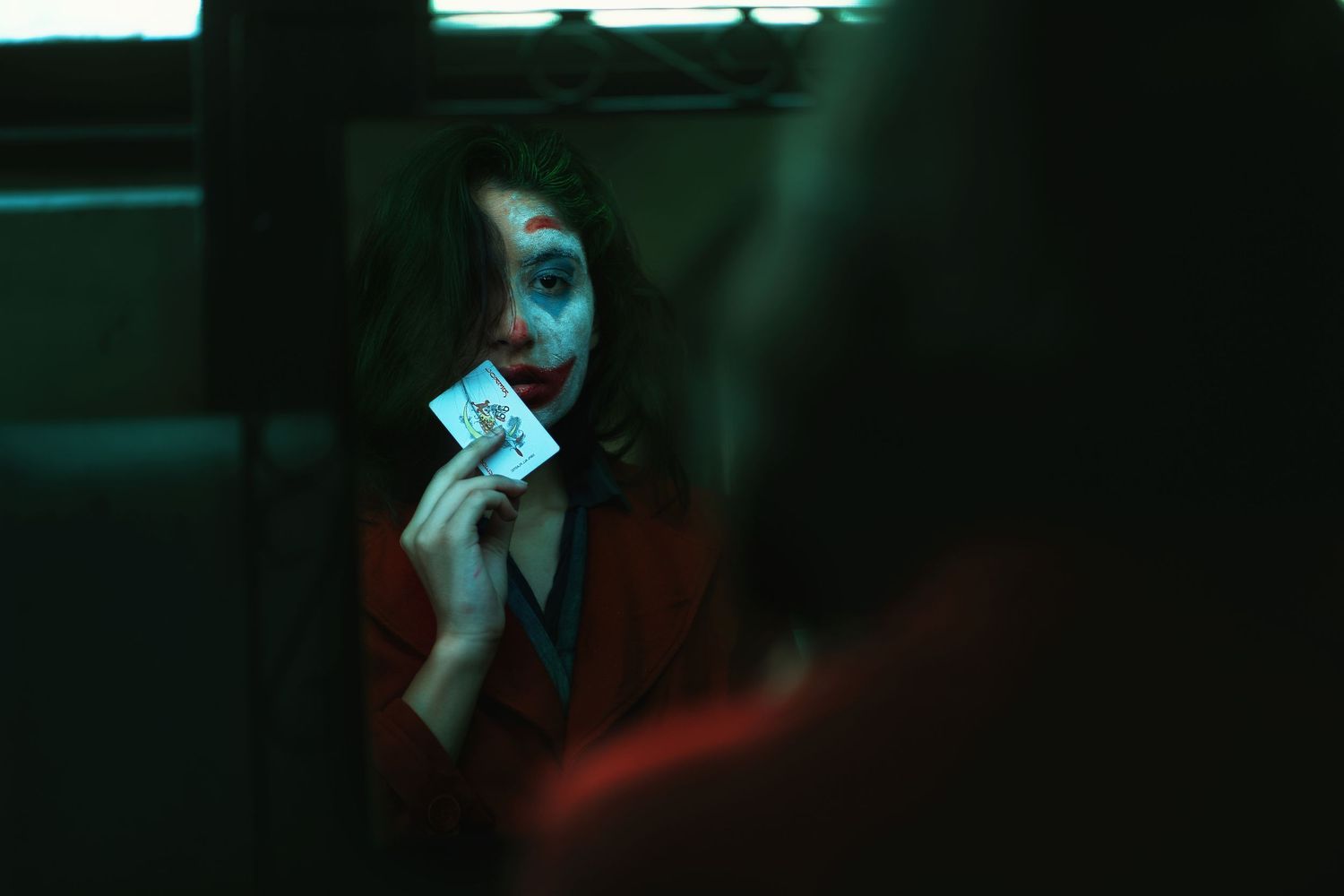 Dramatic portrait series with red and green lighting effects creating a moody atmosphere.