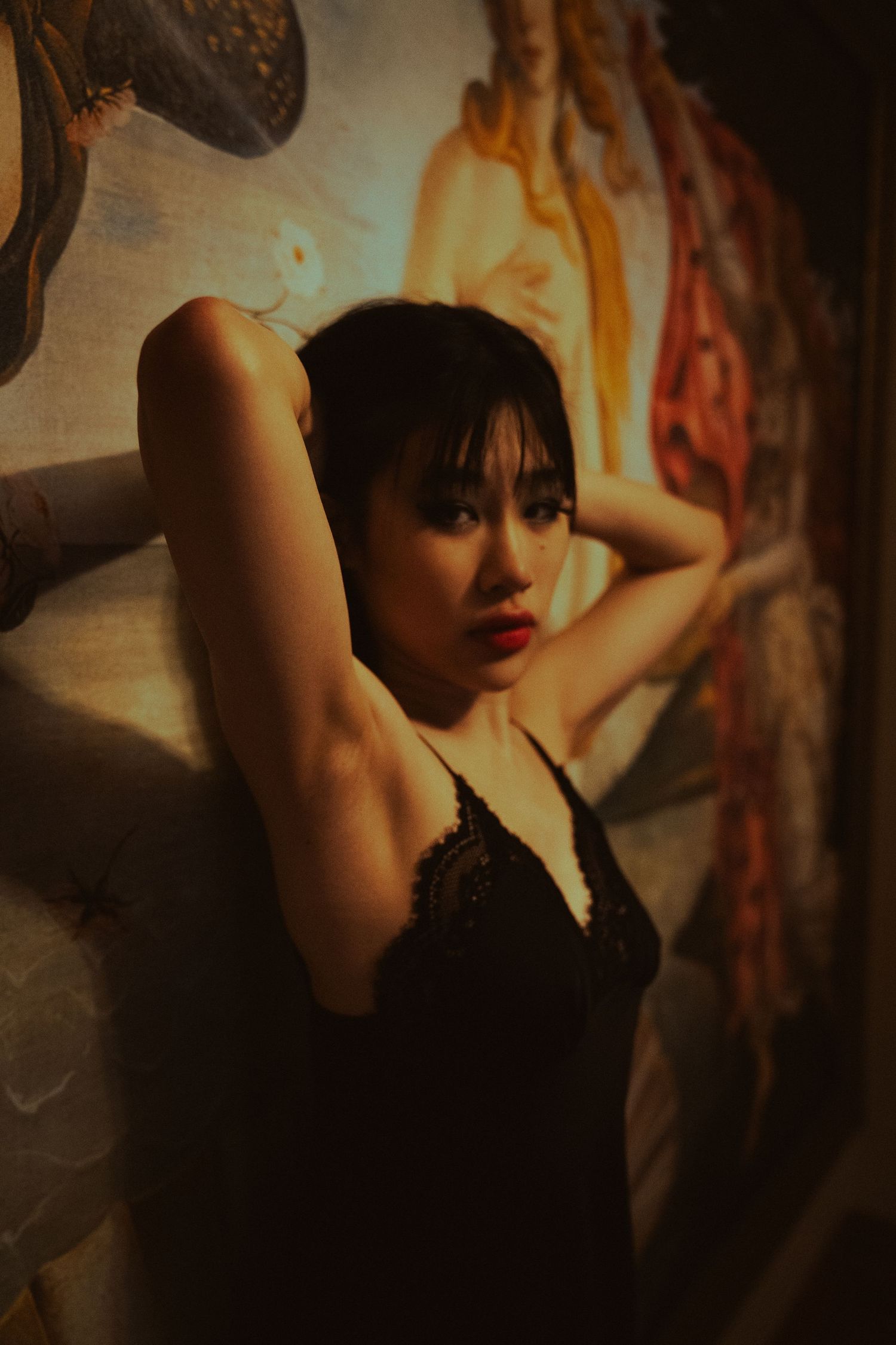 Moody portrait series against classical artwork featuring dramatic shadows and poses.