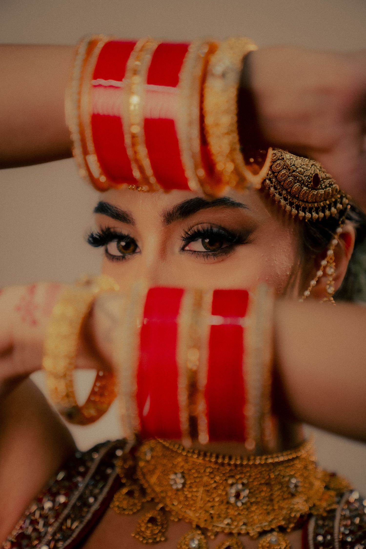 Close-up shots of traditional Indian bridal bangles and jewelry with intricate gold details.