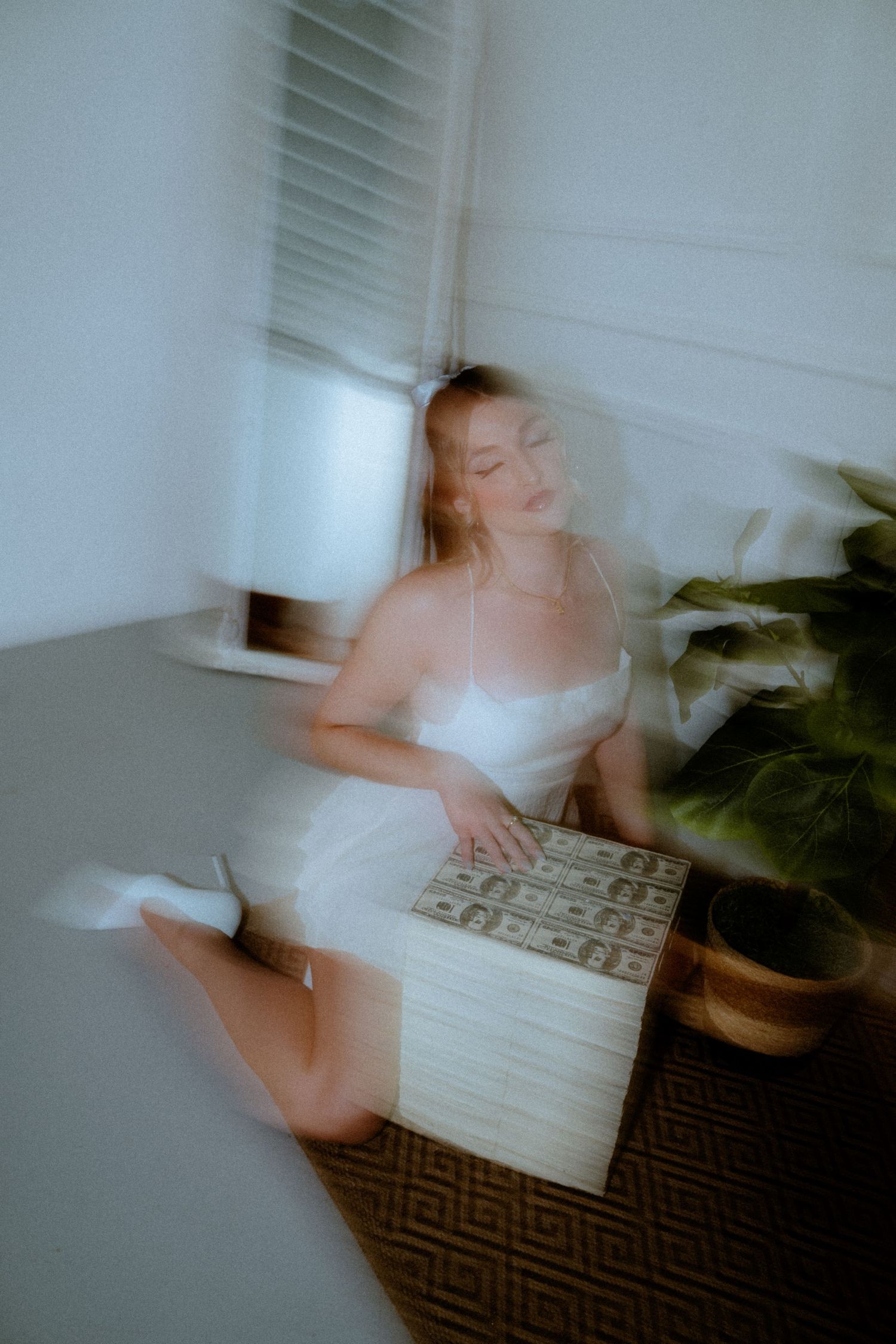 Ethereal motion blur photographs in white interior with minimalist aesthetic.