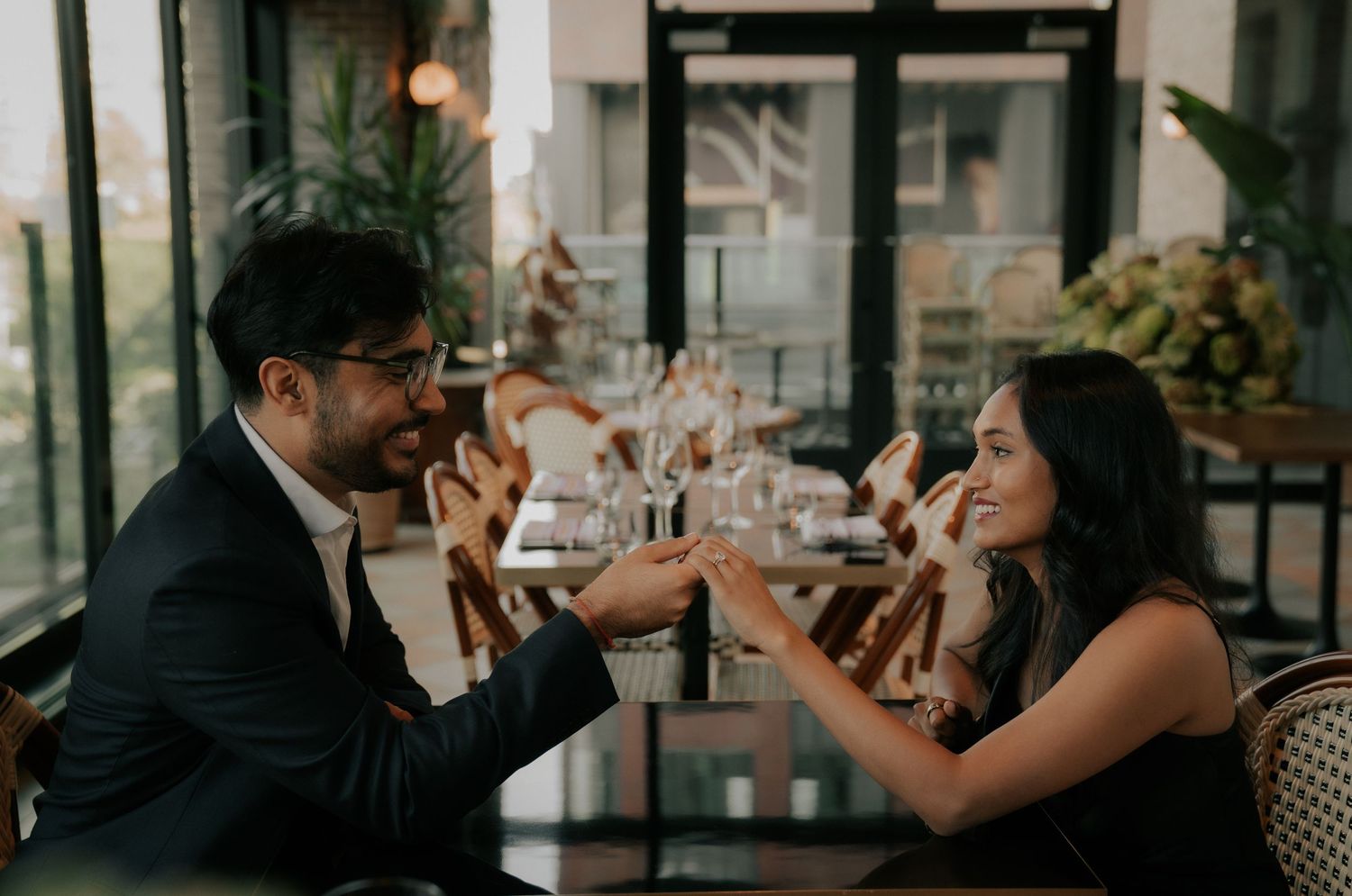 Couples enjoying an intimate dining experience at an elegant restaurant setting.