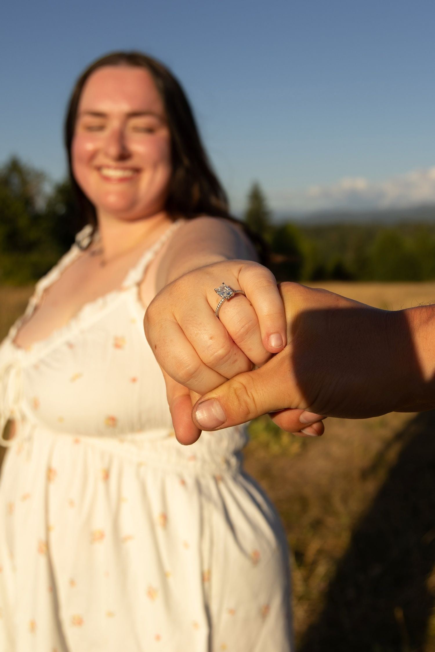 A sequence of four photos showing hands clasped together against a golden sunset background in an outdoor setting.