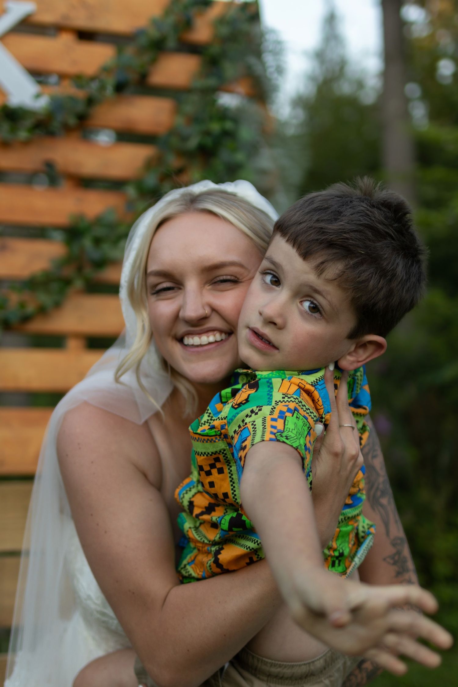 Joyful wedding moments shared between loved ones in an outdoor garden setting.