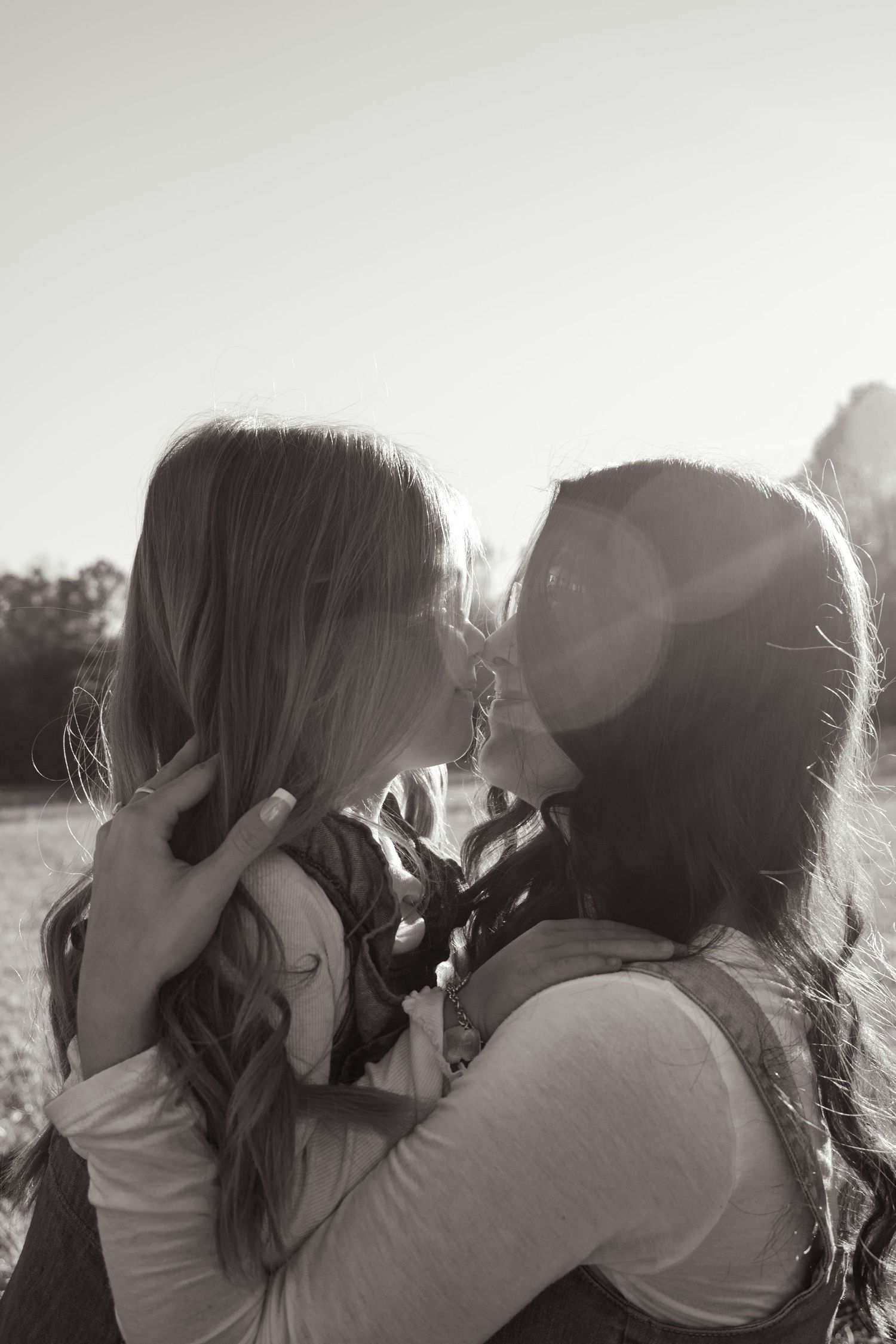 Cozy family moment with kids hugging parents in golden hour light