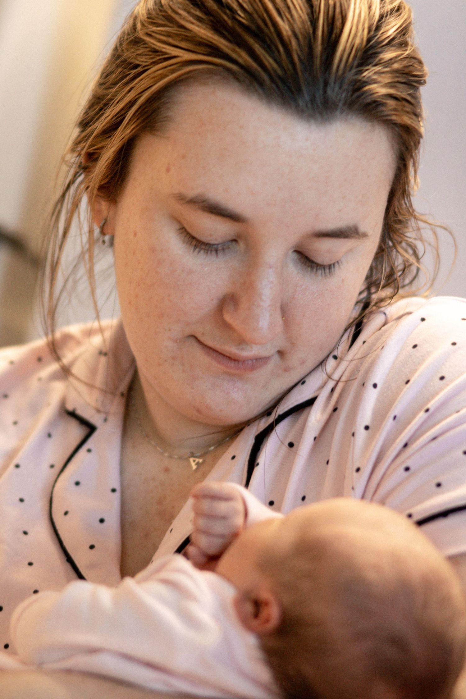 Newborn baby wrapped in hospital blanket during Fresh 48 session