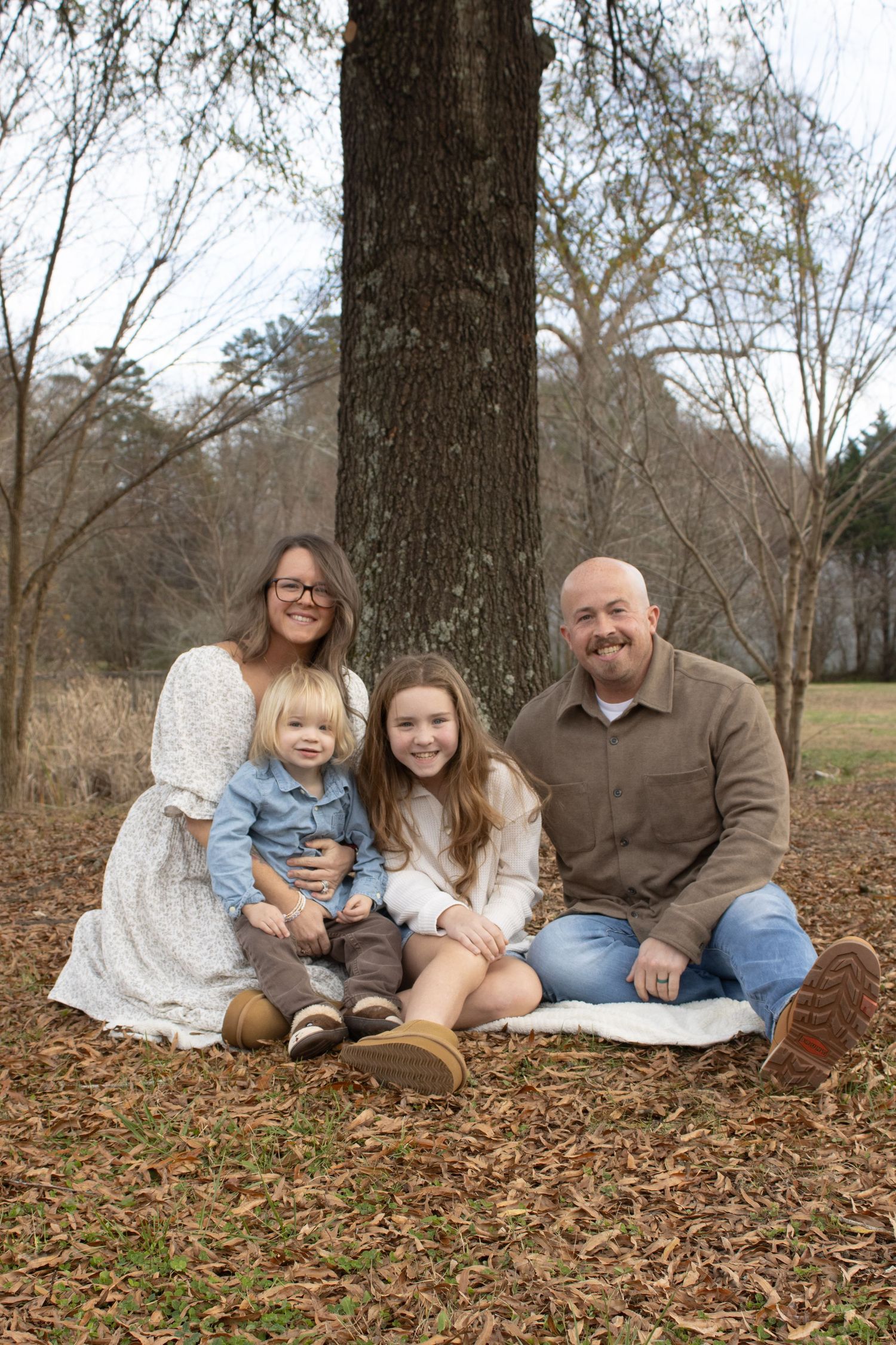 Natural light family portraits with genuine interactions and movement