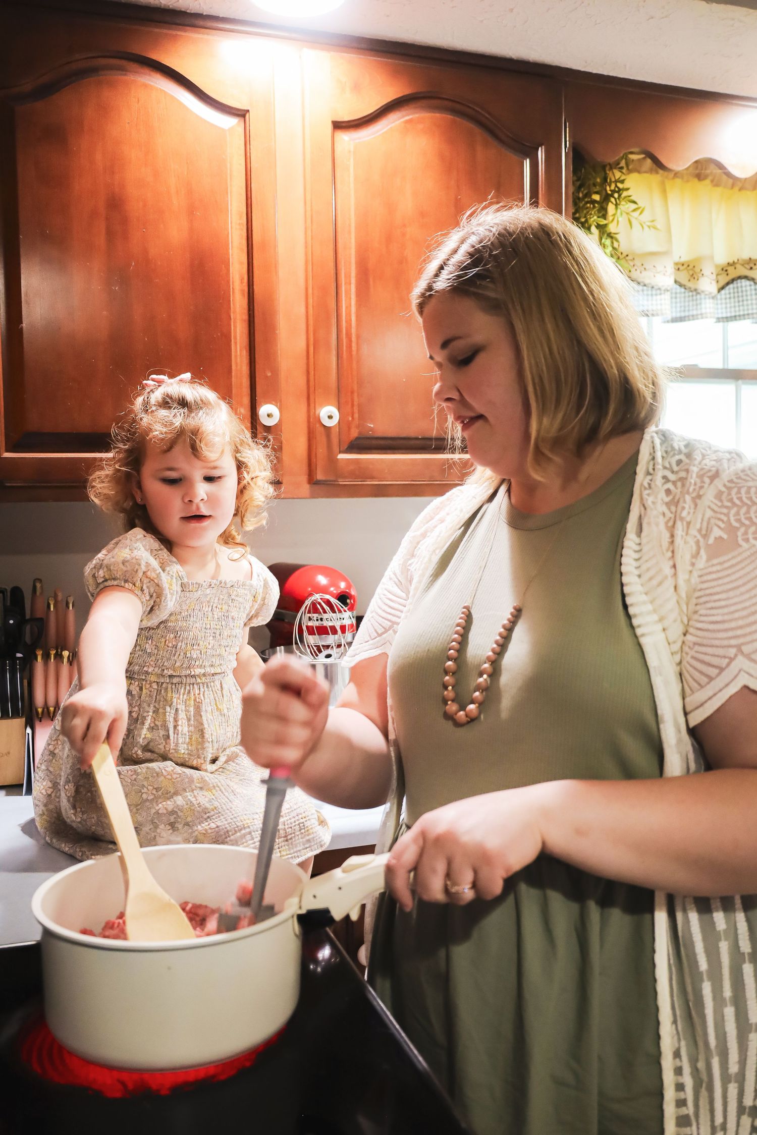 A cooking scene in the kitchen with mixing bowls and baking ingredients.