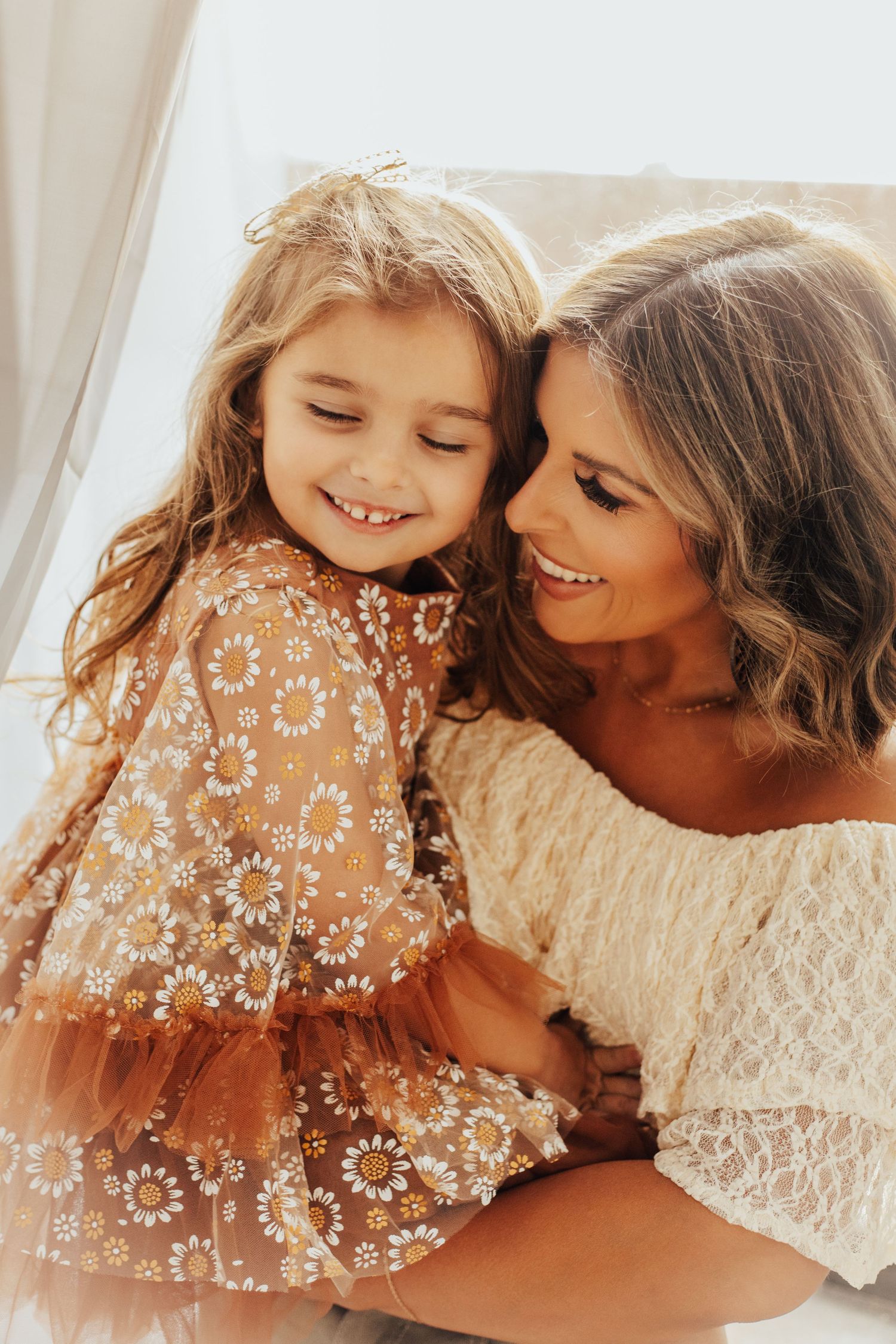 Intimate indoor portrait session with sparkly dress details and warm lighting.
