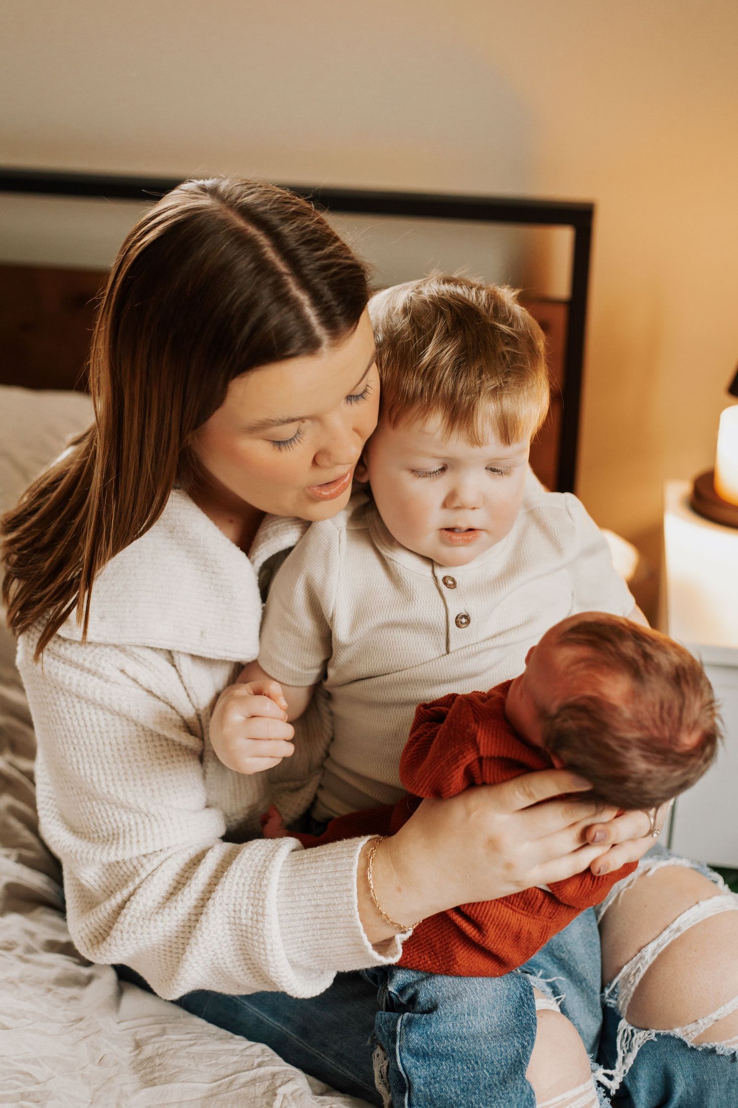 Tender indoor moments captured in warm tones as parent and child share loving embraces.