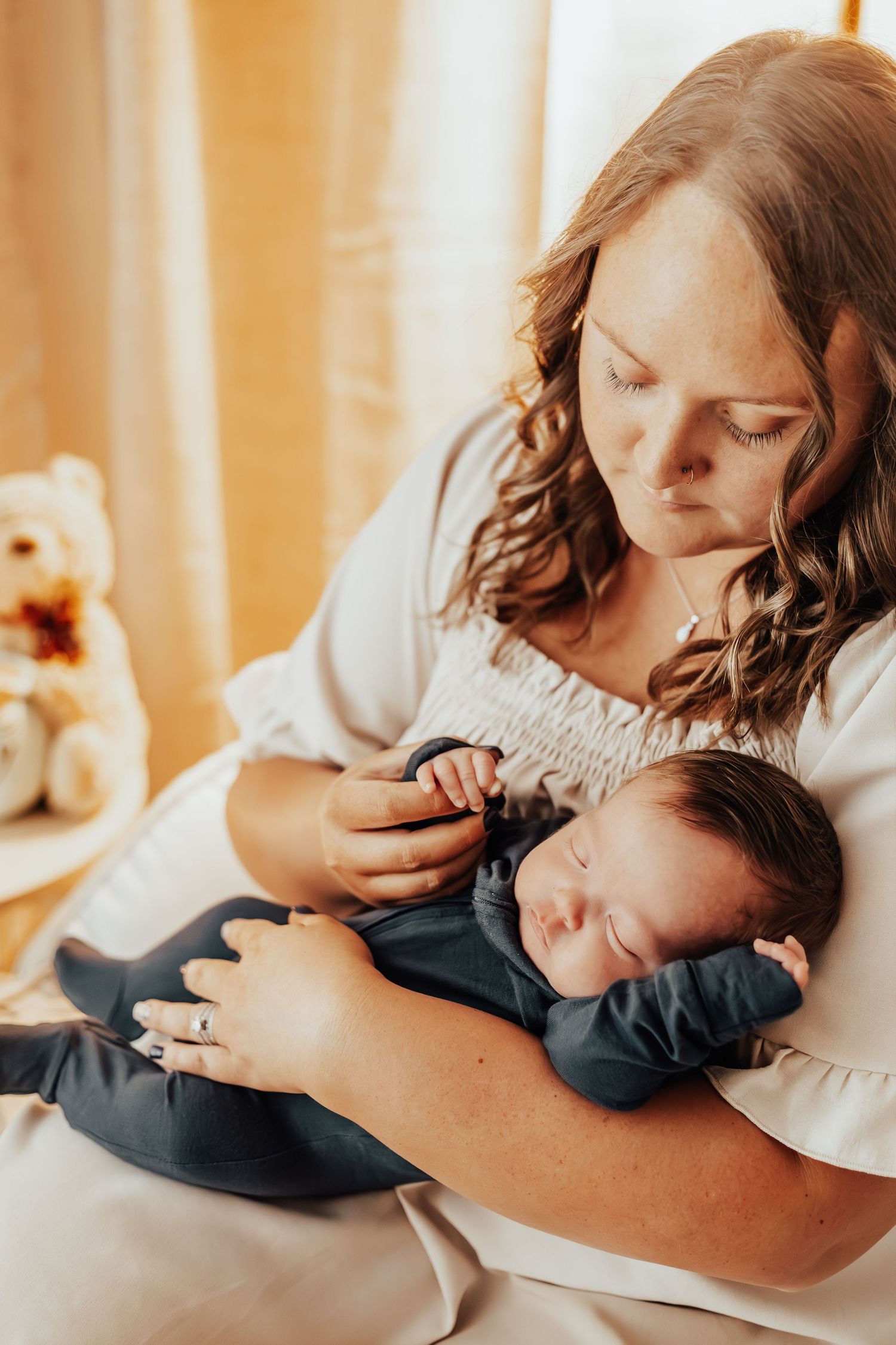 Gentle moments of family bonding captured in warm ambient light.
