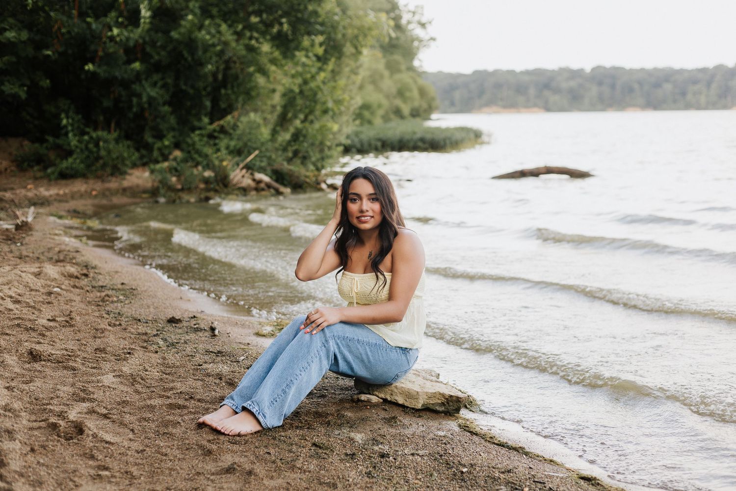 Relaxed beachside portraits with water and shoreline in the background.