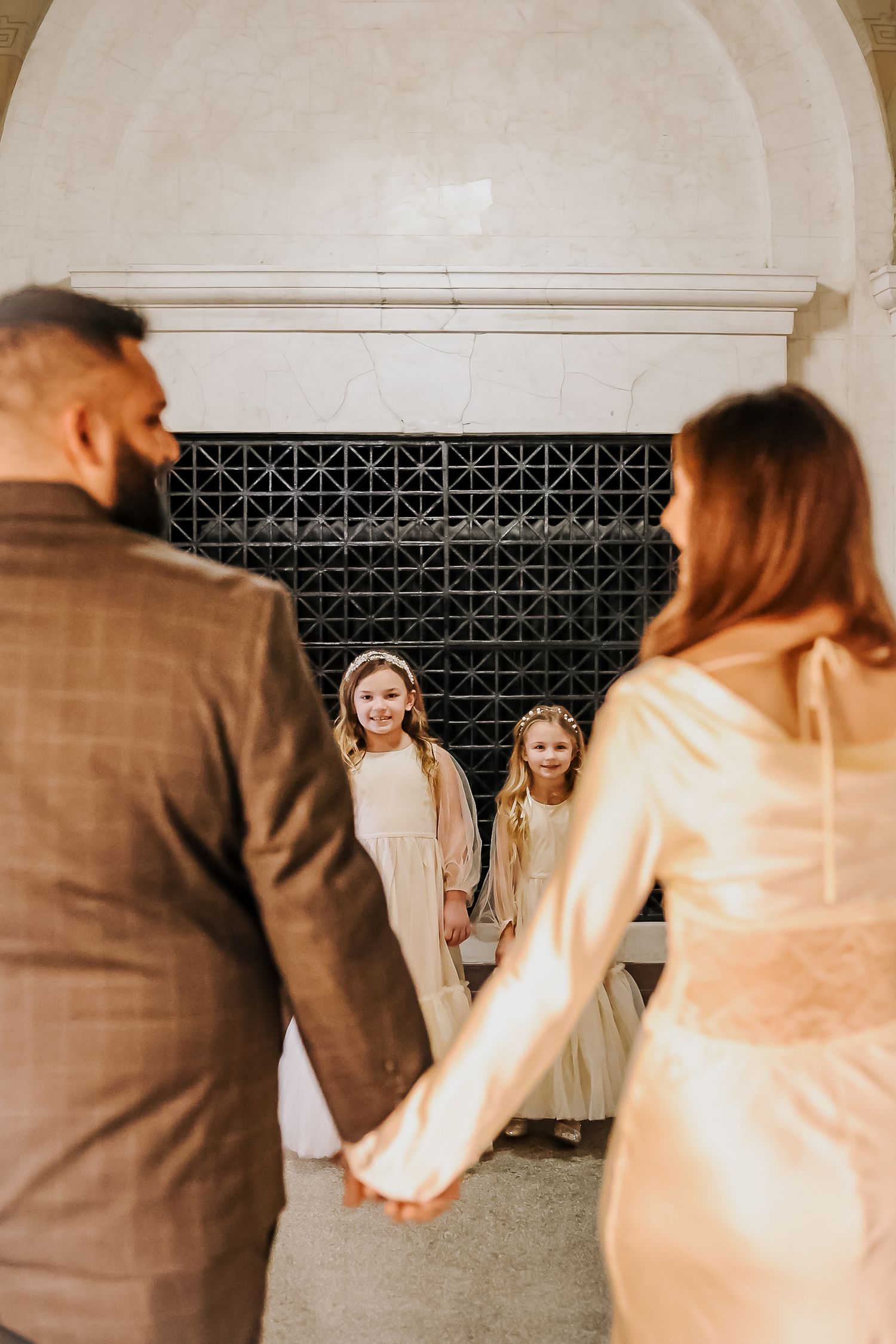 A sequence of wedding photos showing a couple dancing in an elegant venue with ornate details.