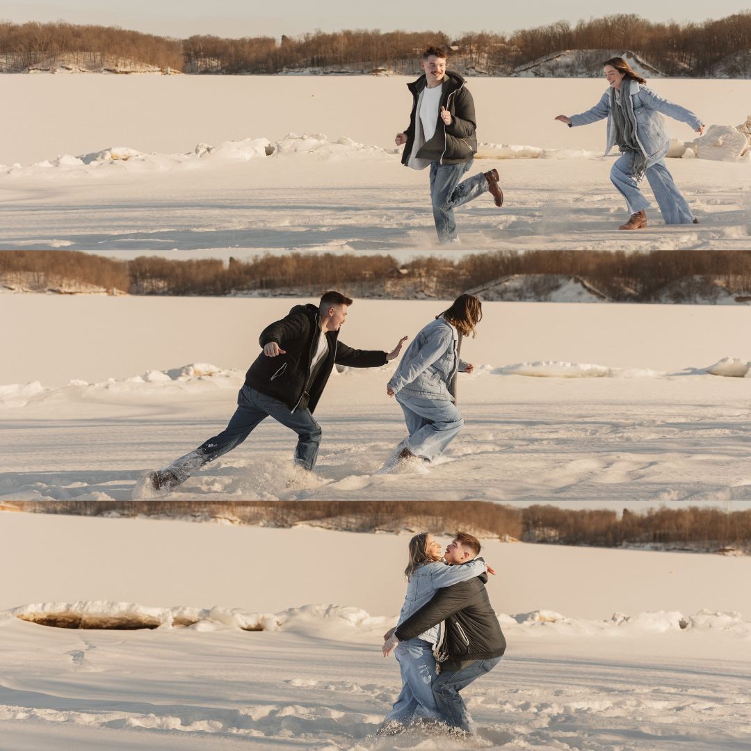 Two people playfully chase each other through a snowy winter landscape.