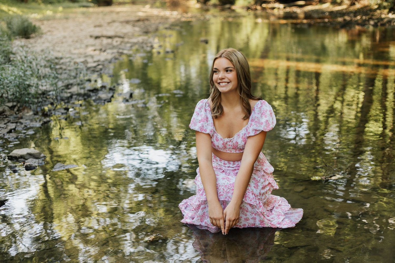 A whimsical creek-side photo session with reflections in the water.