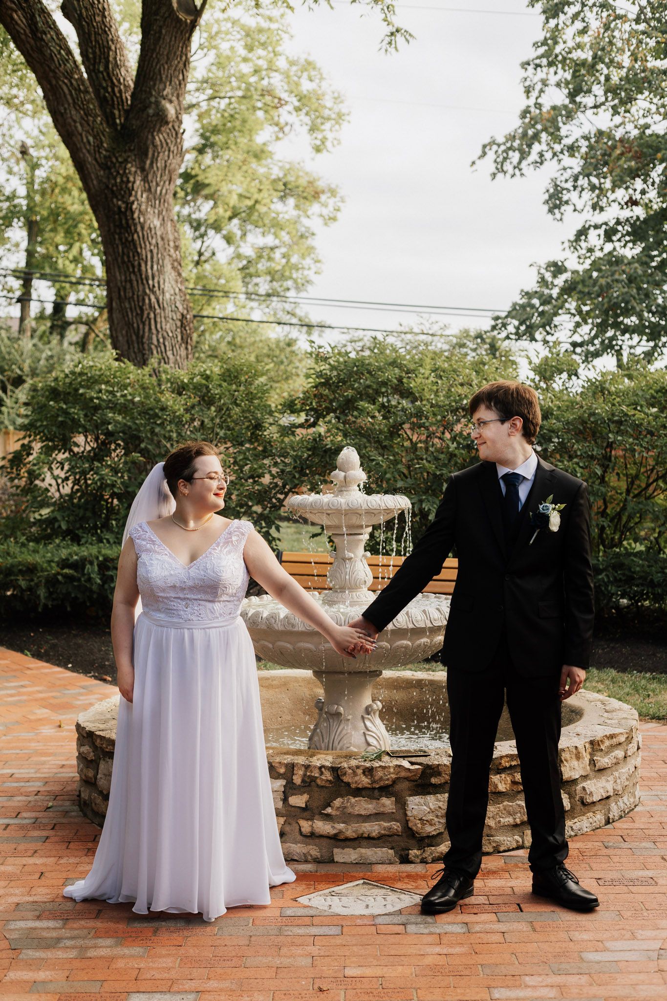 A series of artistic wedding photos showing playful poses on brick steps outdoors.