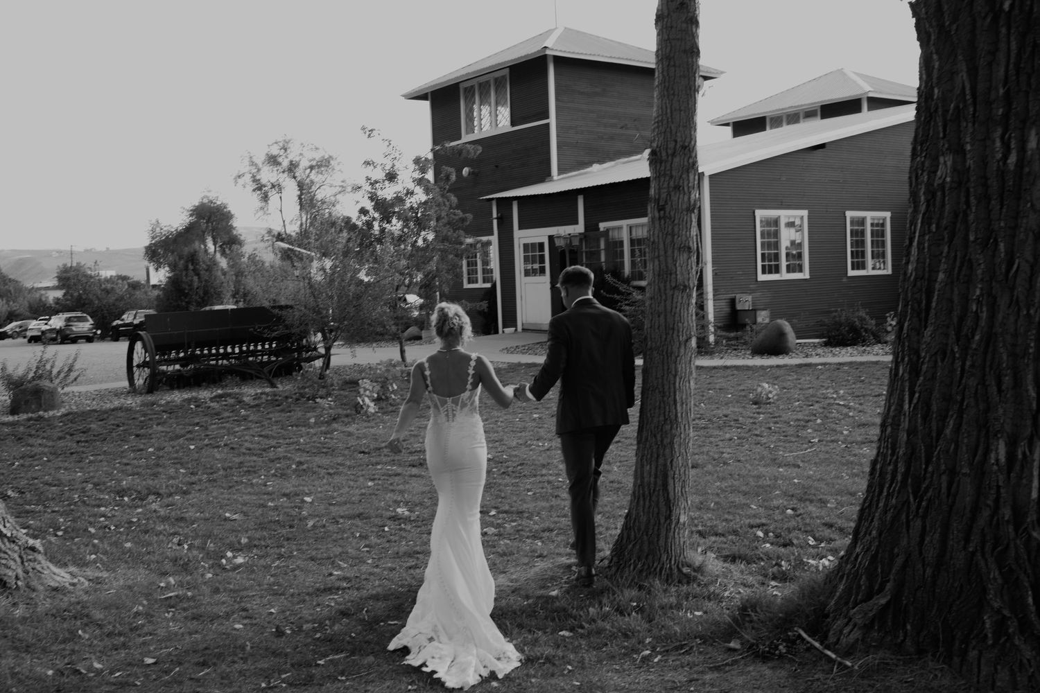 Romantic outdoor wedding photography session with natural landscape backdrop.
