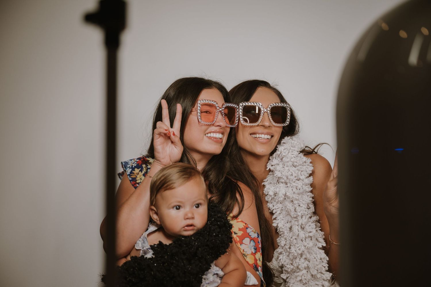 Wedding party poses playfully in a candid photo sequence showing joyful celebration moments.