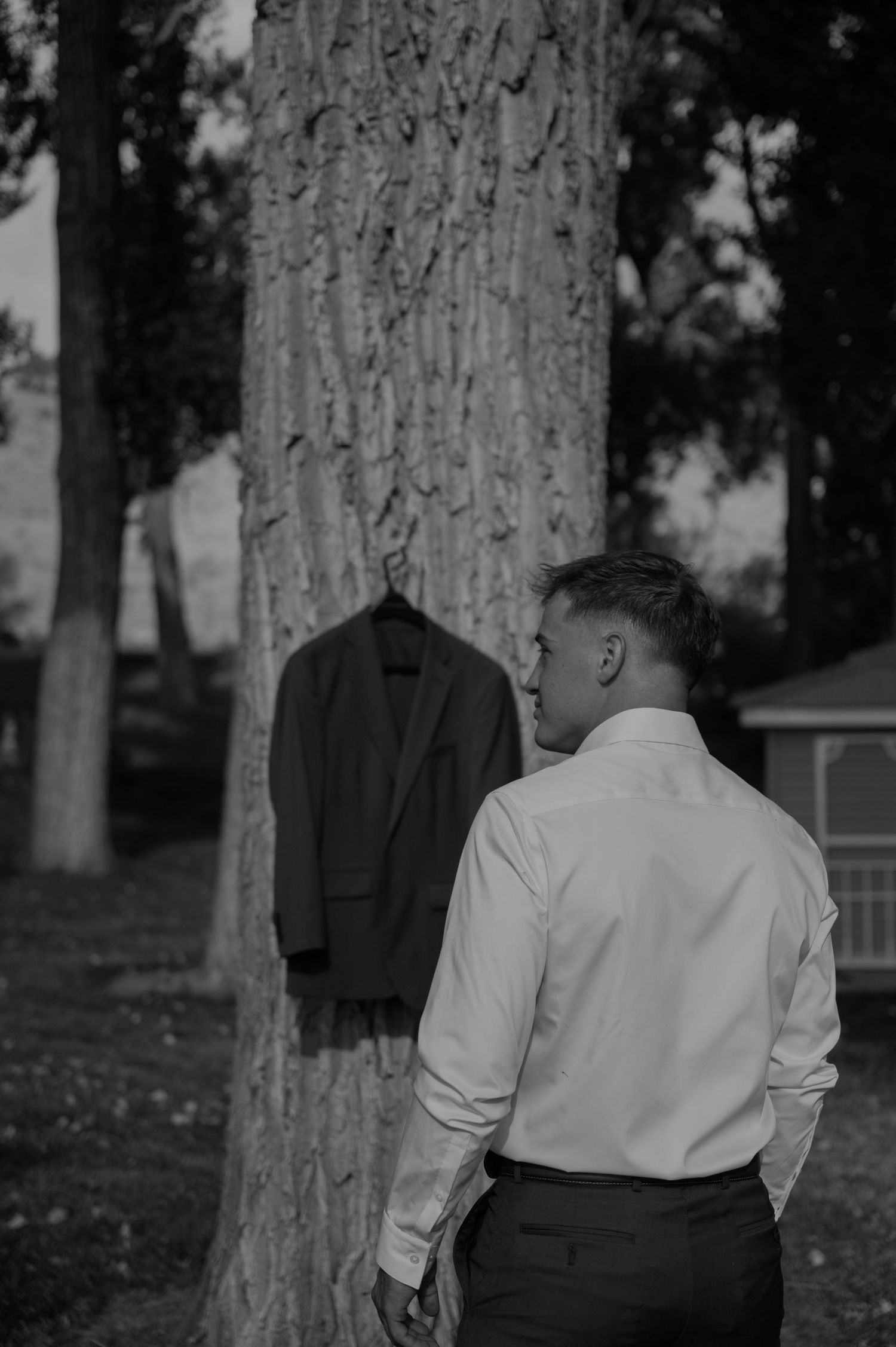 Black and white photographs capturing candid moments in a wooded area.