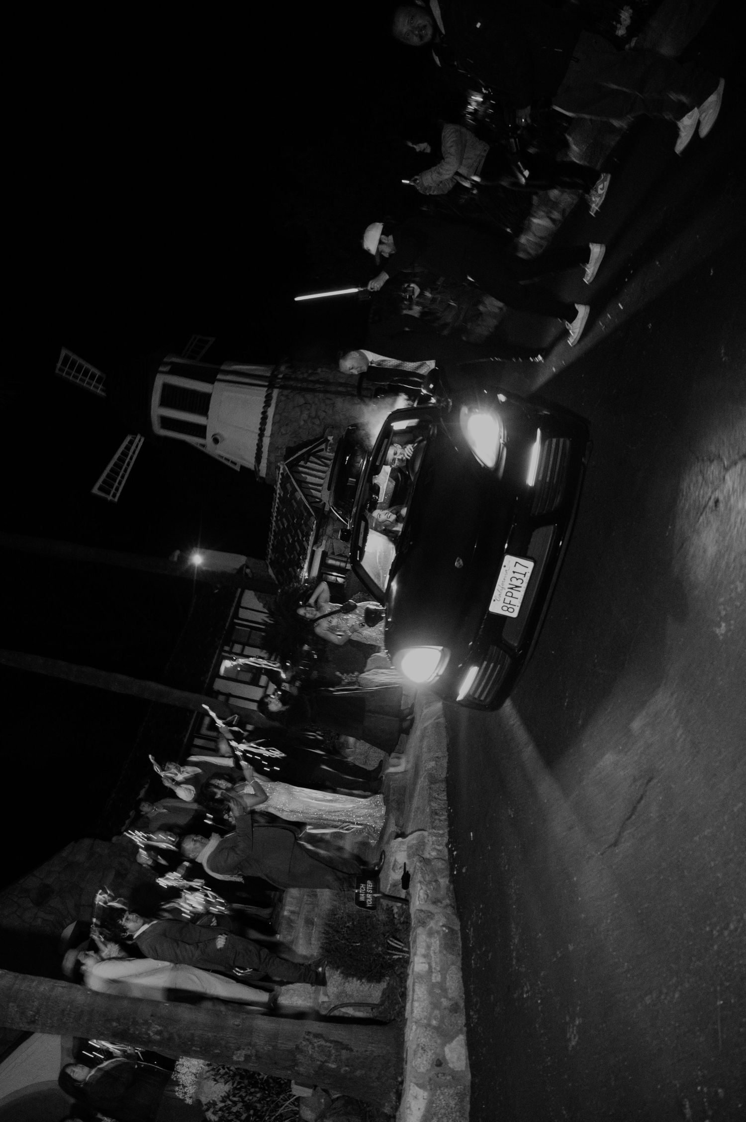 Dark concert venue with stage lighting and performance equipment.