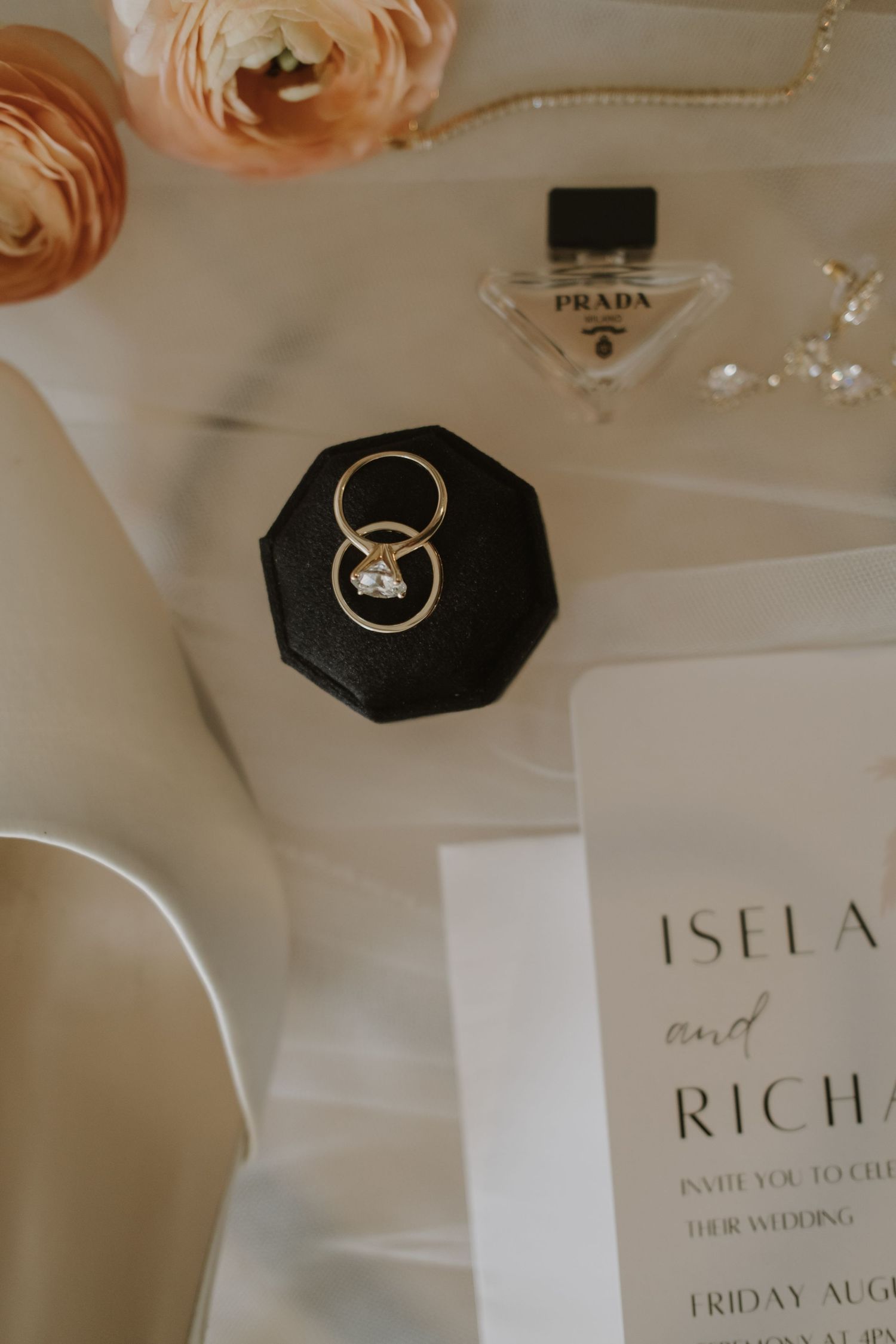 Wedding details including peach roses, Prada perfume, and invitation cards.
