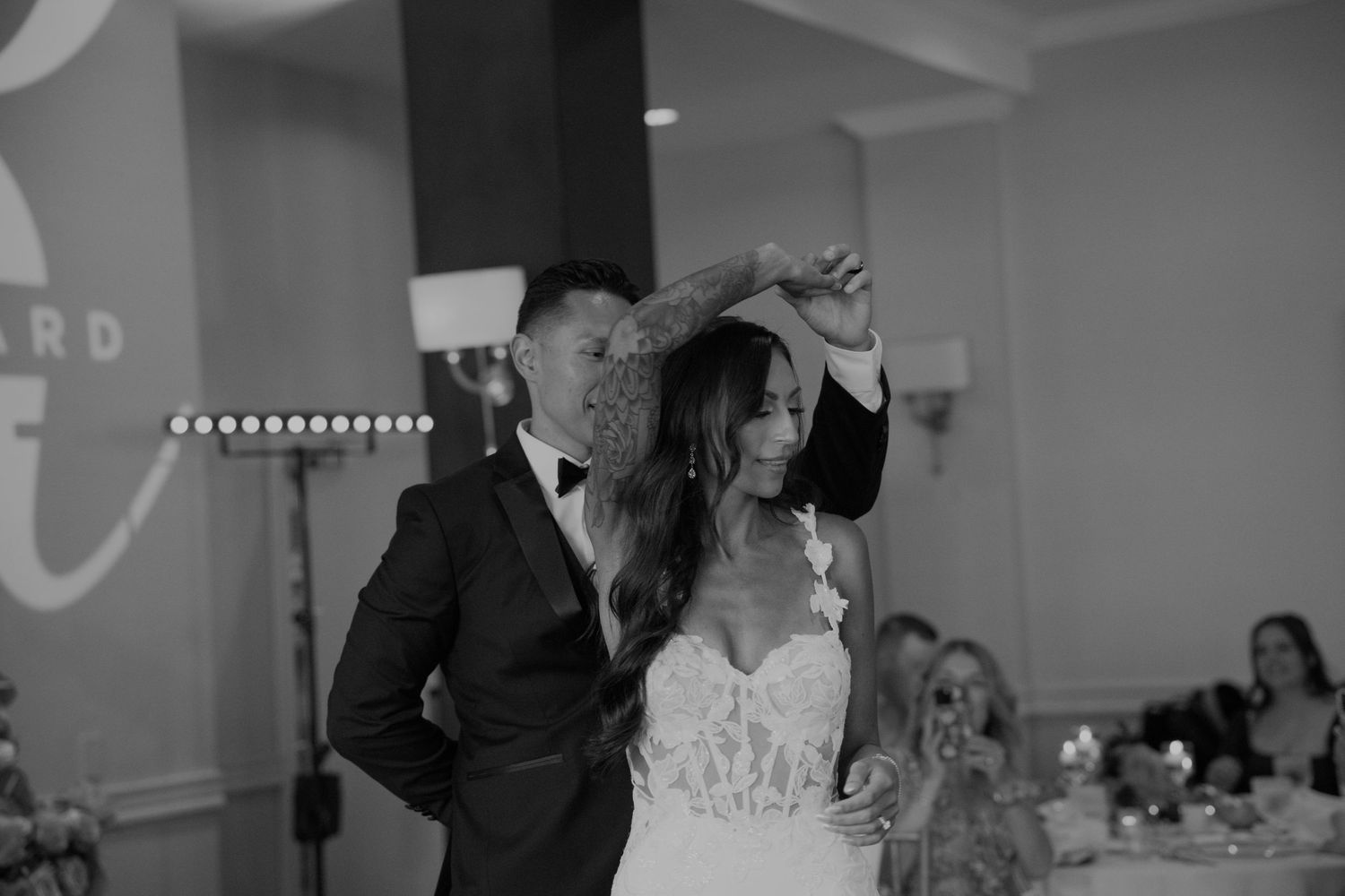 A couple shares their first dance at their wedding reception.