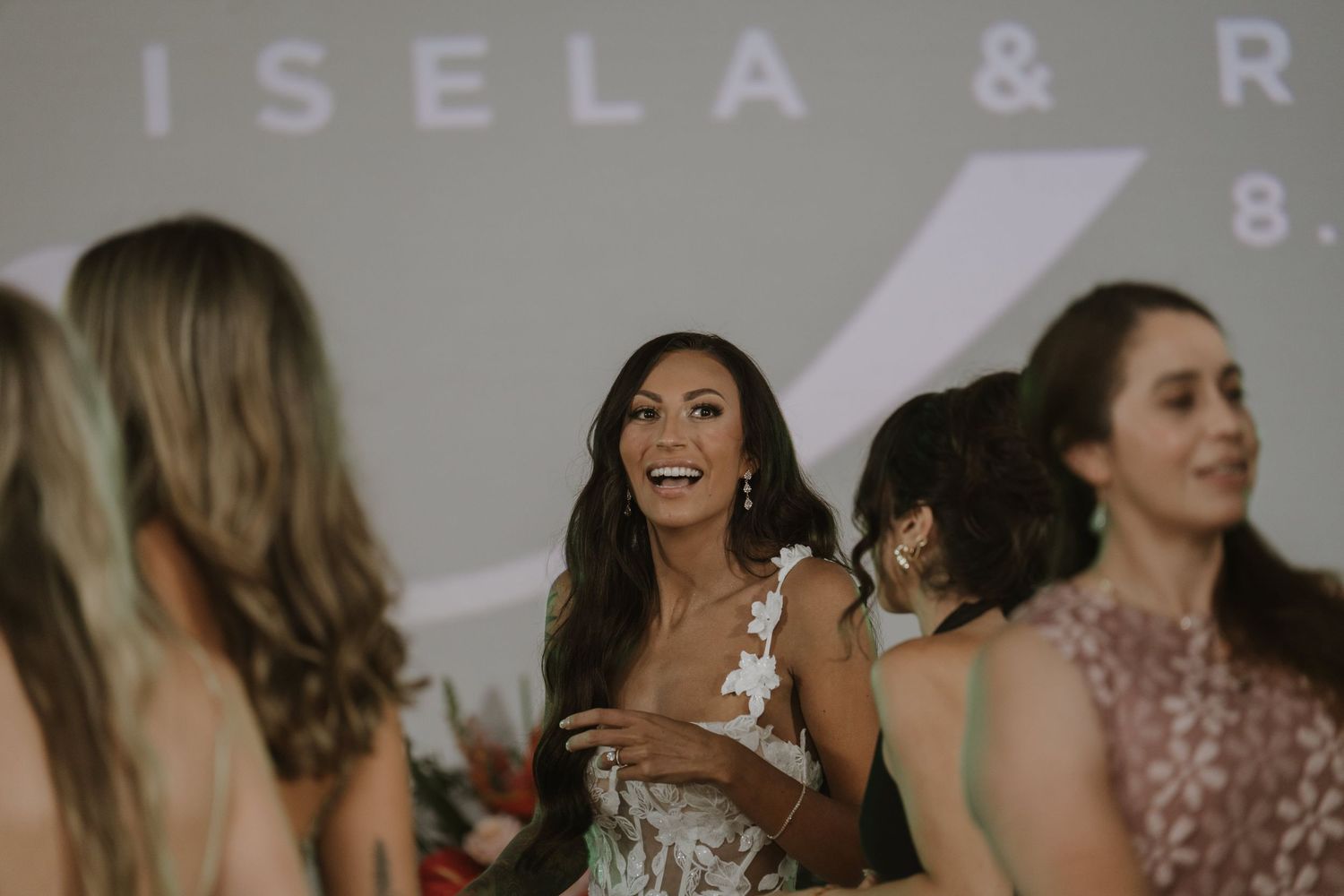 Wedding guests enjoying themselves on the dance floor during a reception celebration.