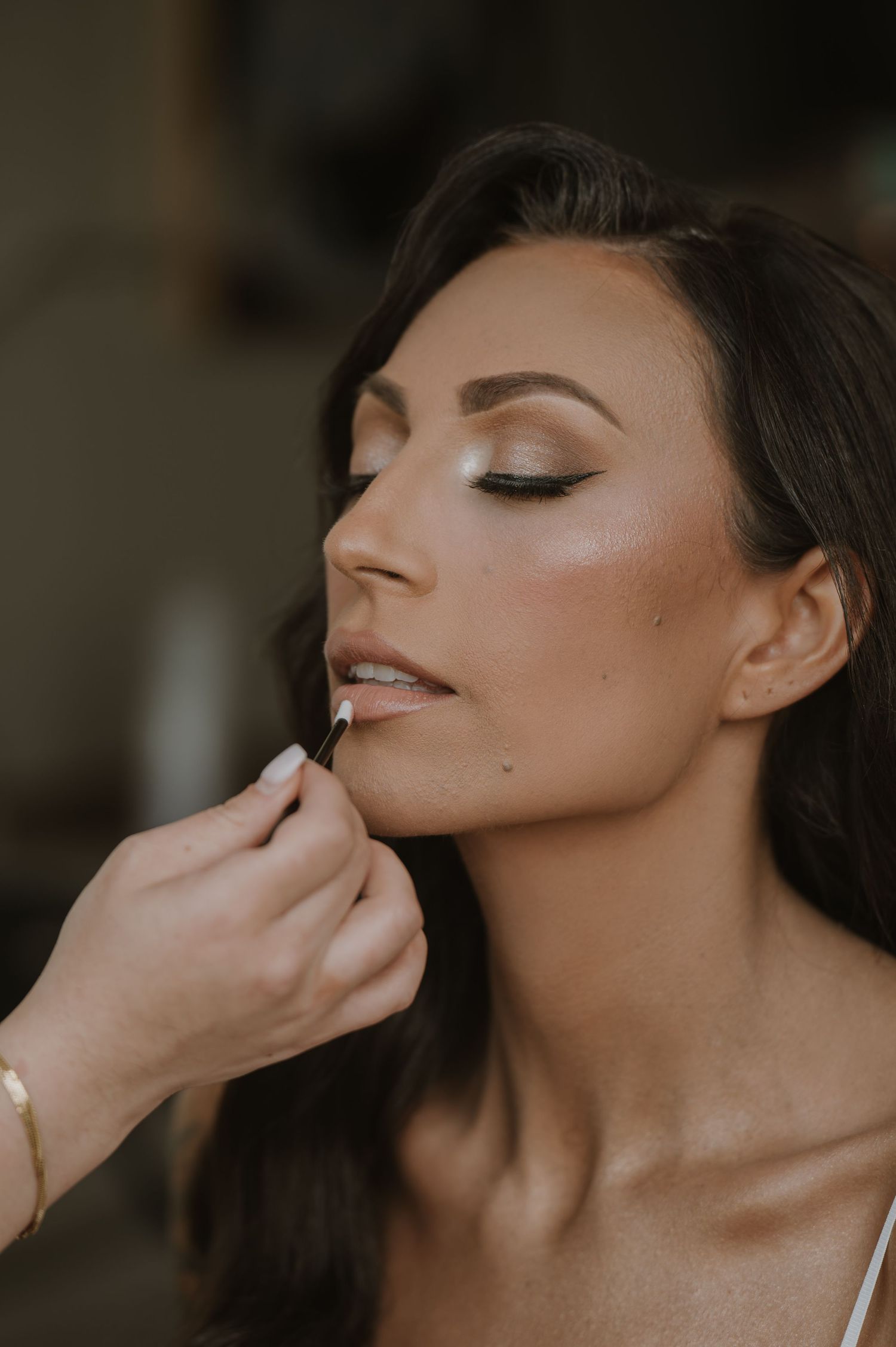 Close-up beauty shot showing elegant bridal makeup.