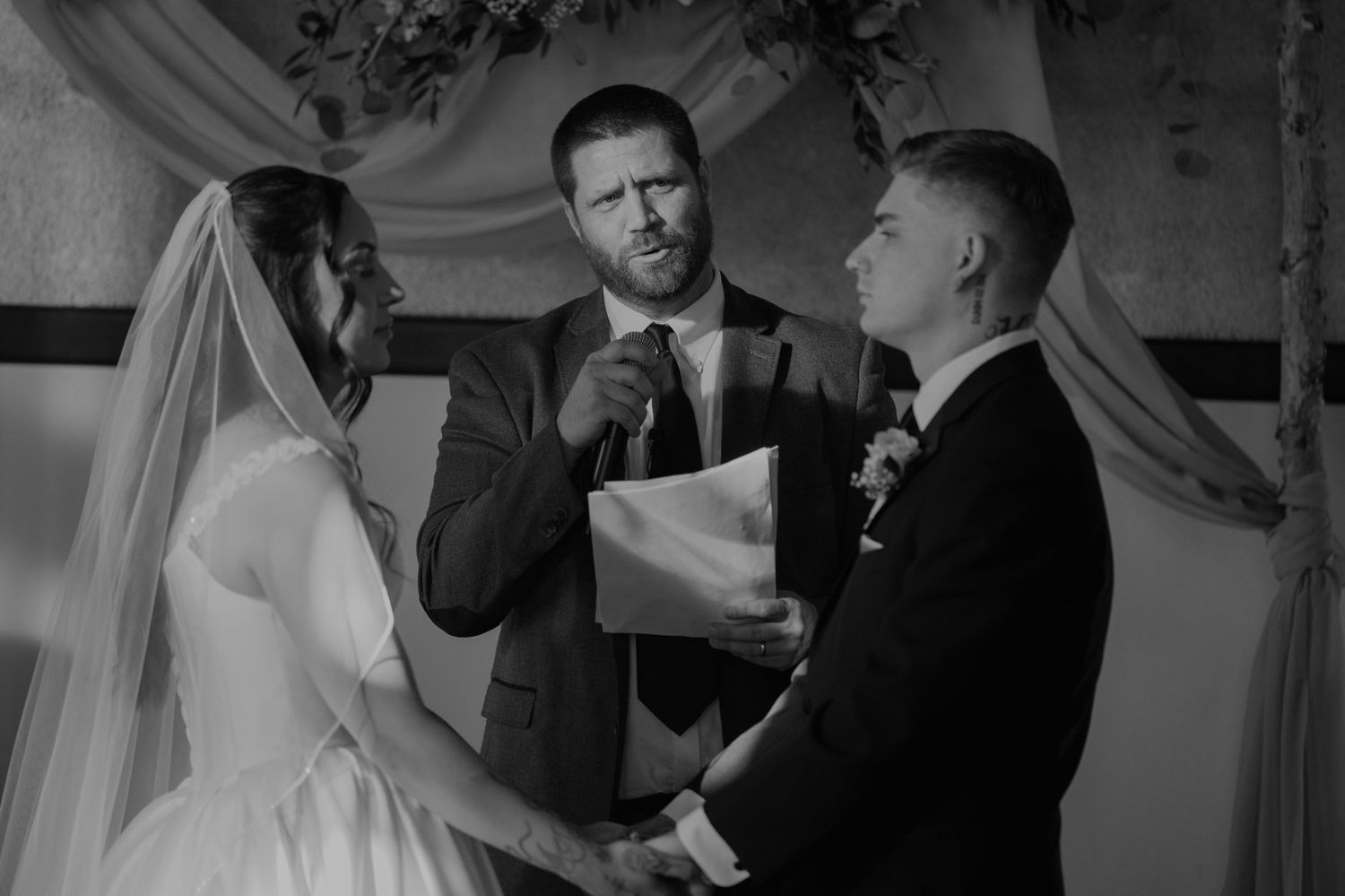 Black and white candid wedding moments captured indoors with natural light.