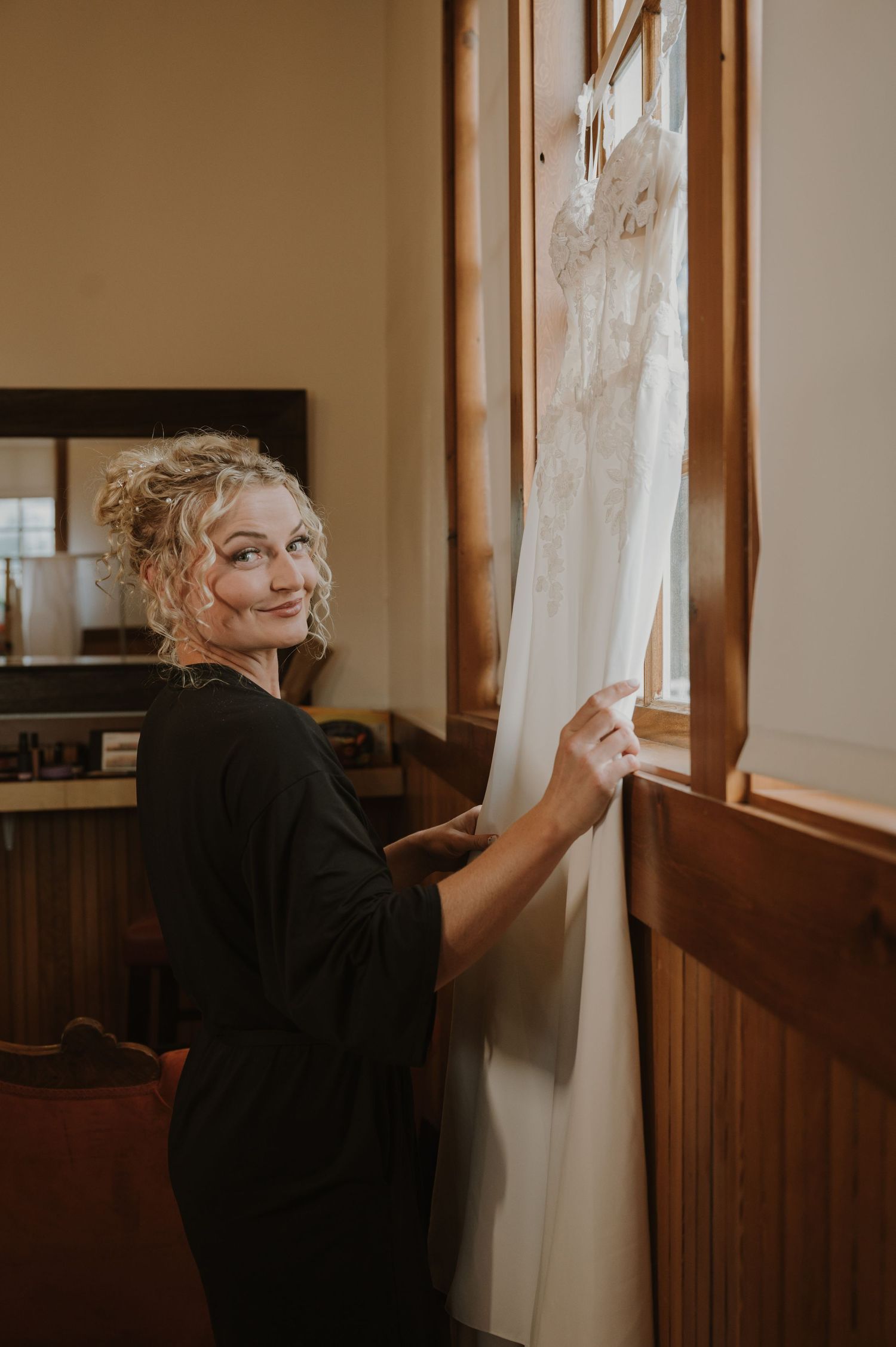 Soft natural light streams through windows during wedding day preparations.