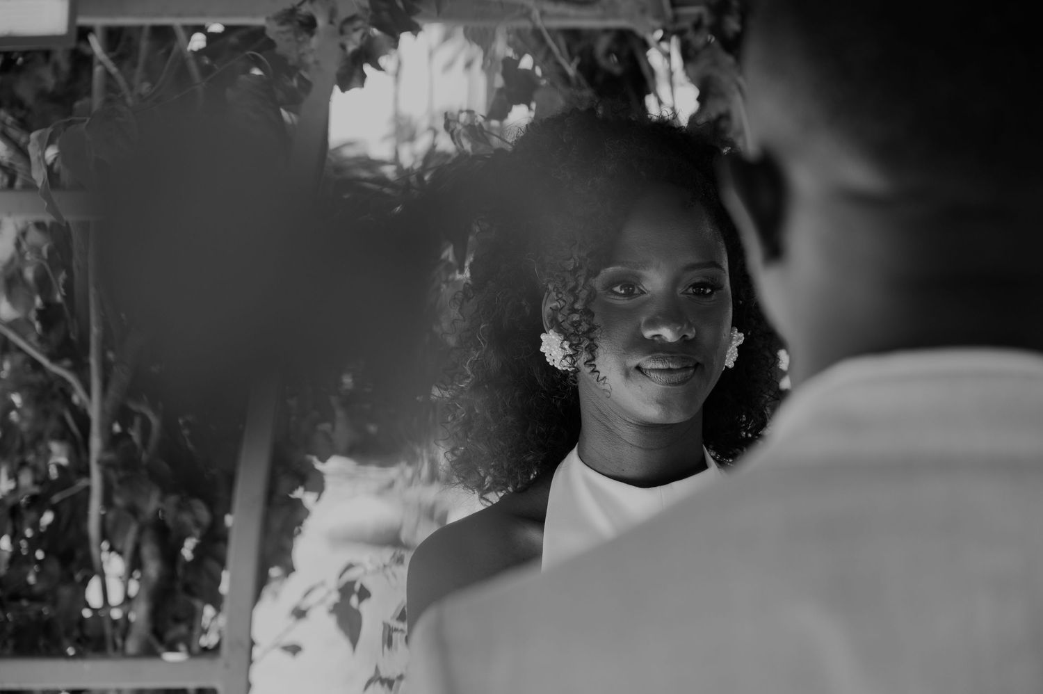 A romantic black and white portrait capturing an intimate moment between a couple.