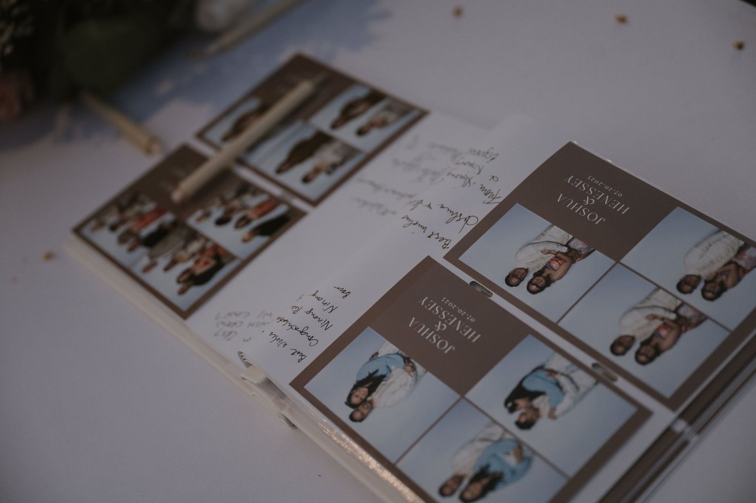 Wedding photo booth guestbook with printed photo strips and handwritten messages on display table.