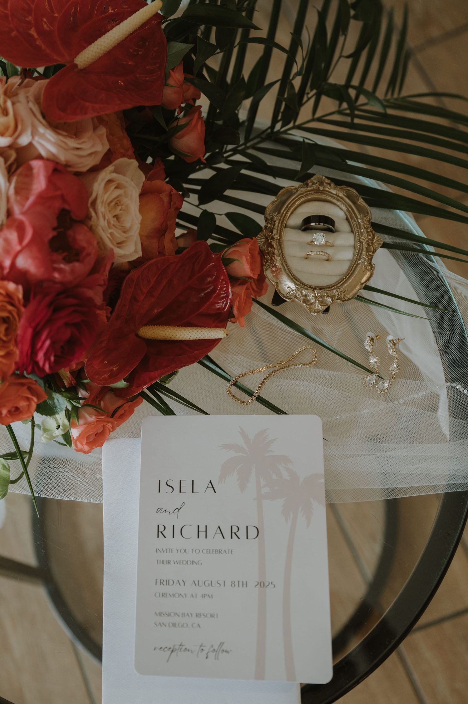 Wedding place cards with floral decorations and elegant table settings.
