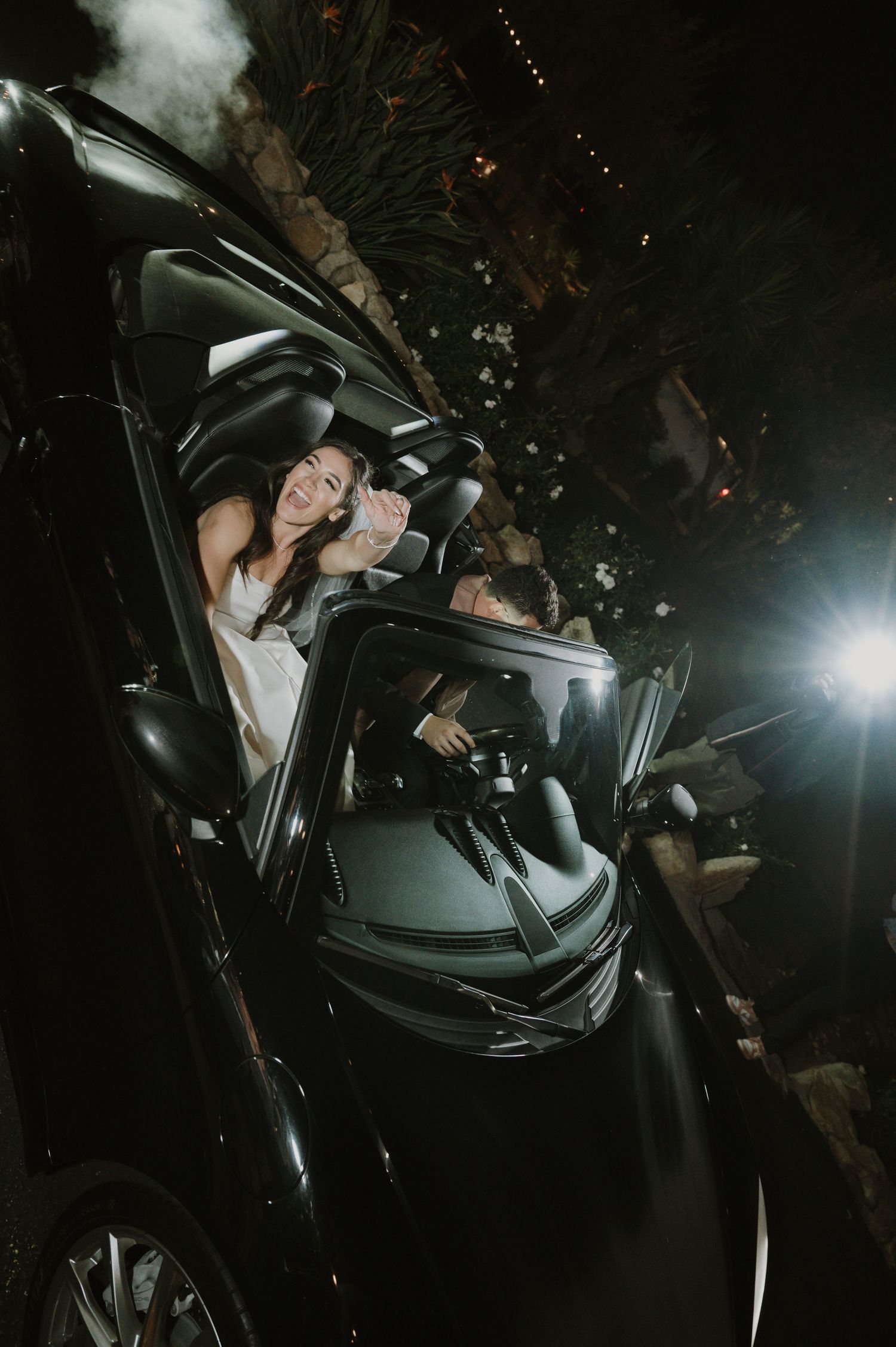 Nighttime view through car windows with flash photography and ambient lighting.