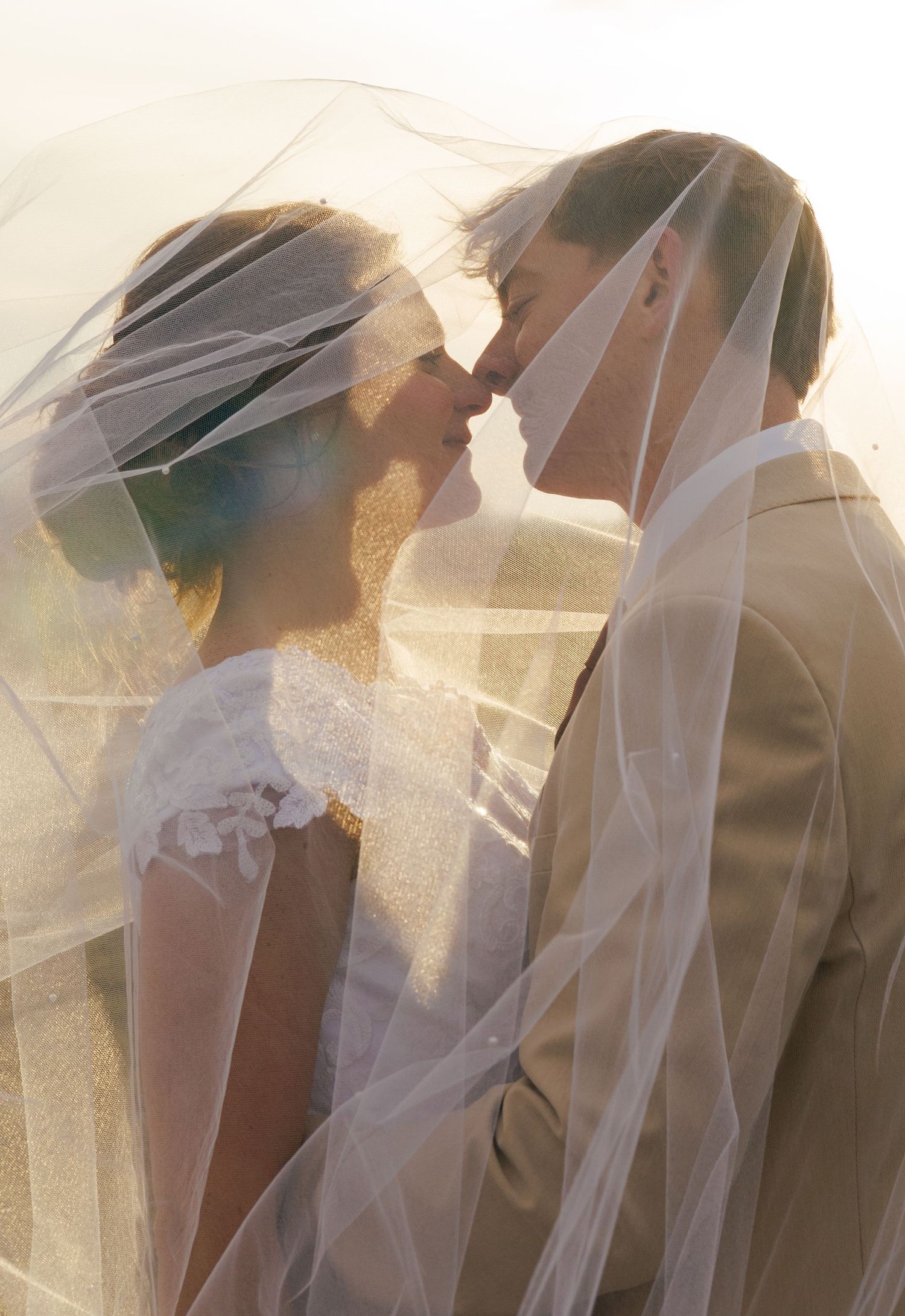 Dreamy wedding photo sequence with sunlit veils creating romantic silhouettes at golden hour.