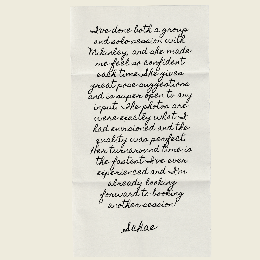 A handwritten note on white paper with cursive text.