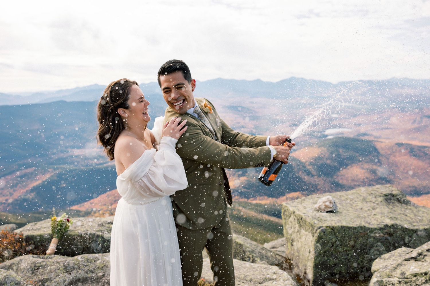 Wedding photography session on a scenic mountain overlook.