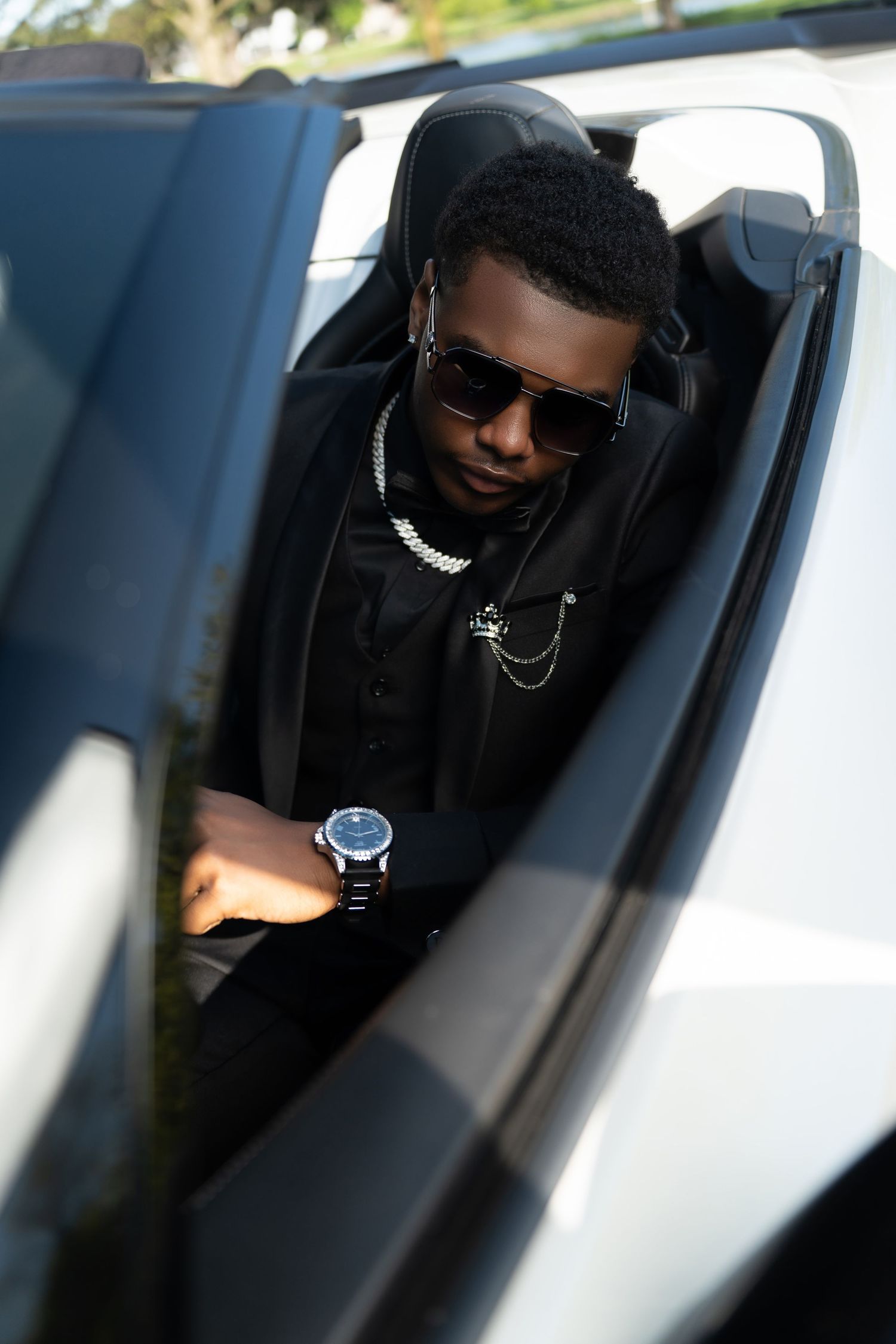 A sequence of photos showing someone wearing sunglasses in a car from different angles through the window.