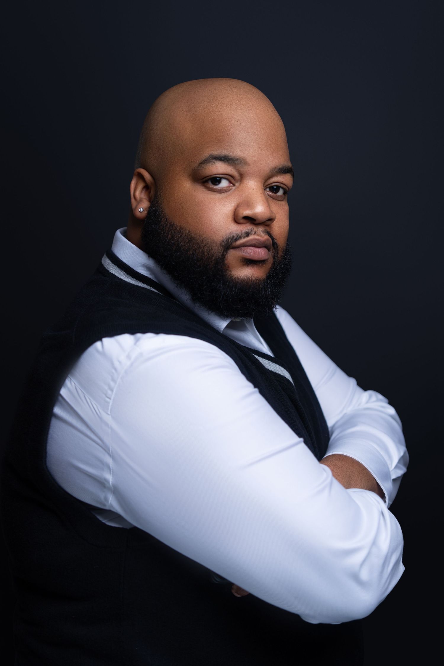 Professional portrait series against dark background showing dramatic lighting and white dress shirt with black tie.