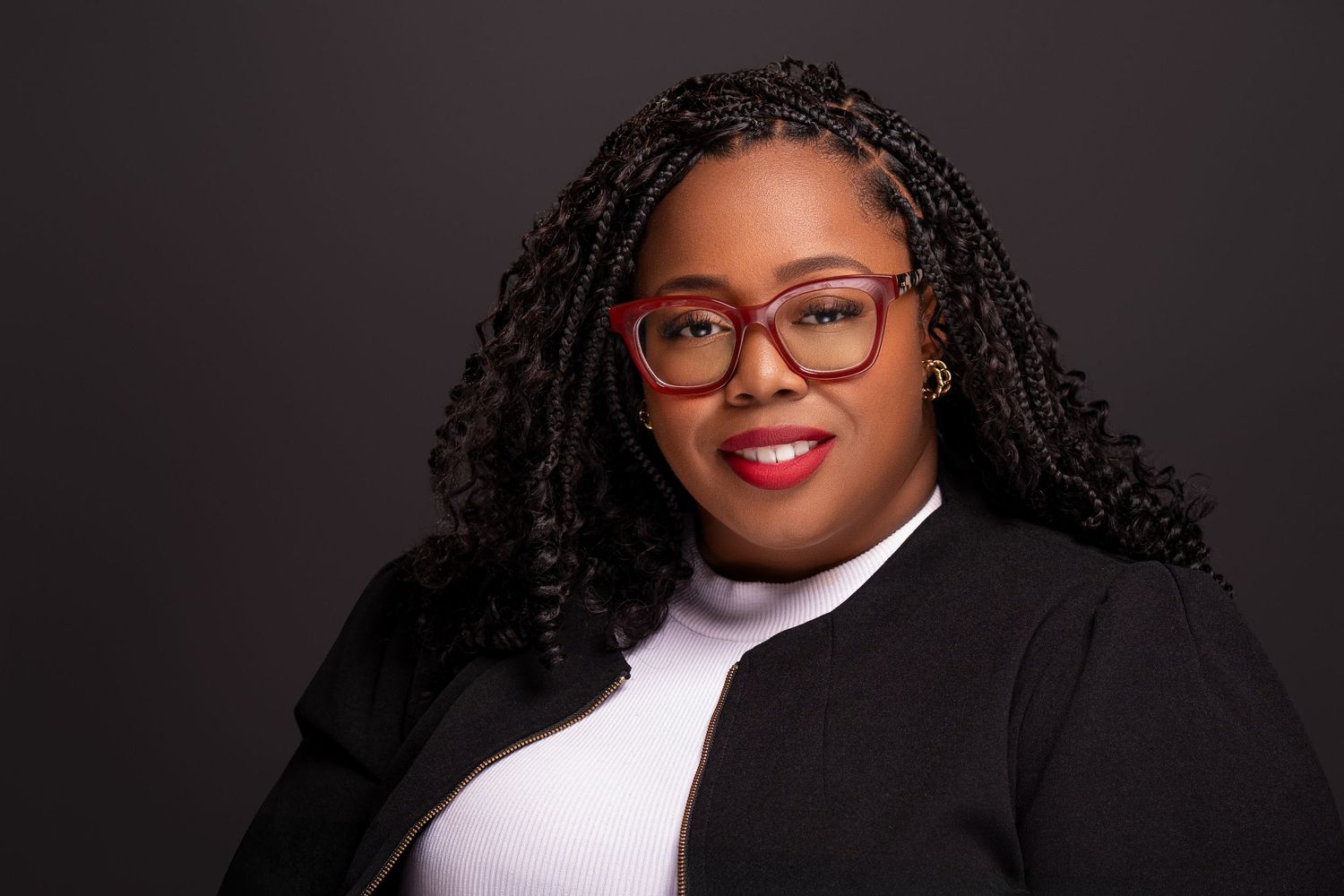 Professional headshot portraits against dark background.