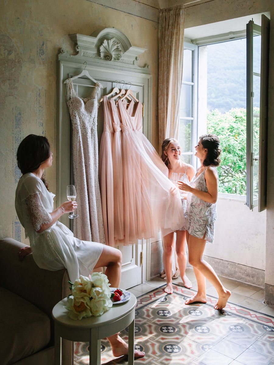 A series of artistic photos showing a person in white robe holding up a peach-colored dress by a window.