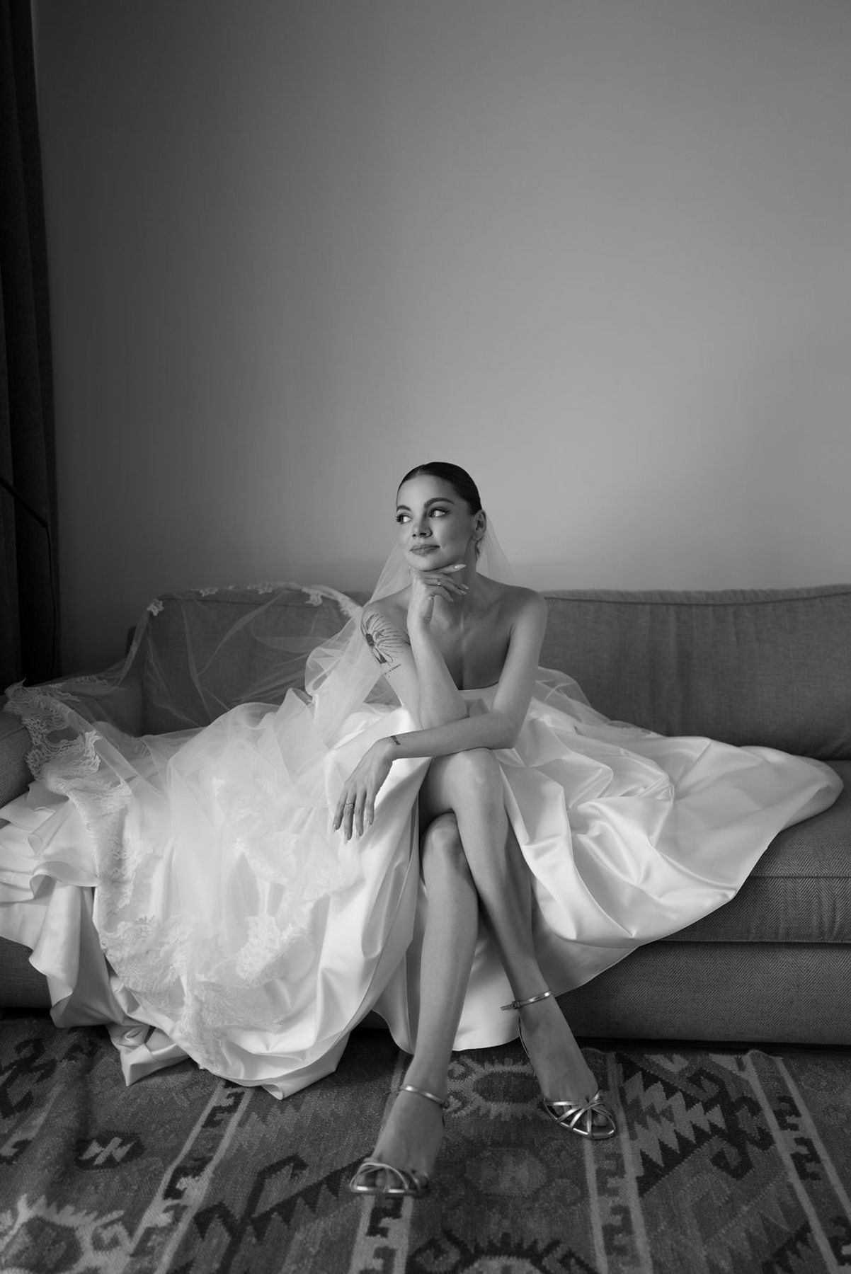 A black and white photo sequence showing someone lounging on a couch in a flowing white dress.